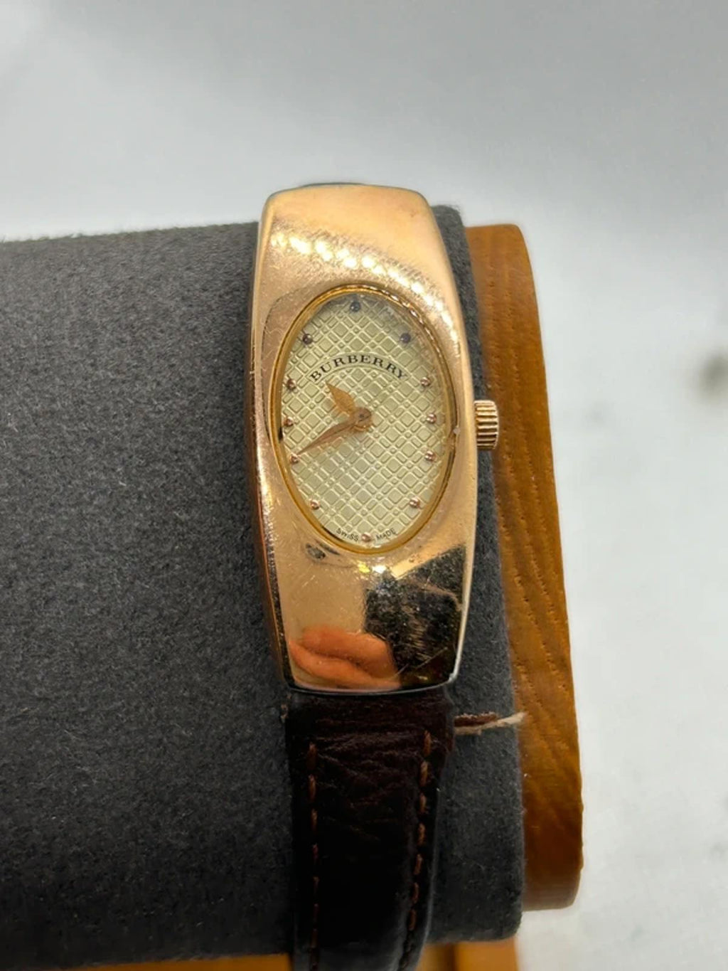 Ladies Burberry watch rose gold case with pattern dial and broken brown strap