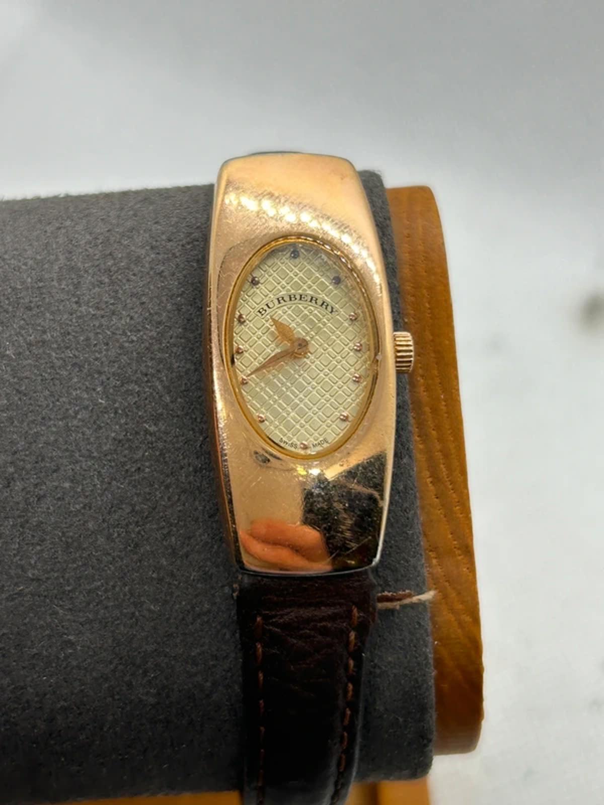 Ladies Burberry watch rose gold case with pattern dial and broken brown strap