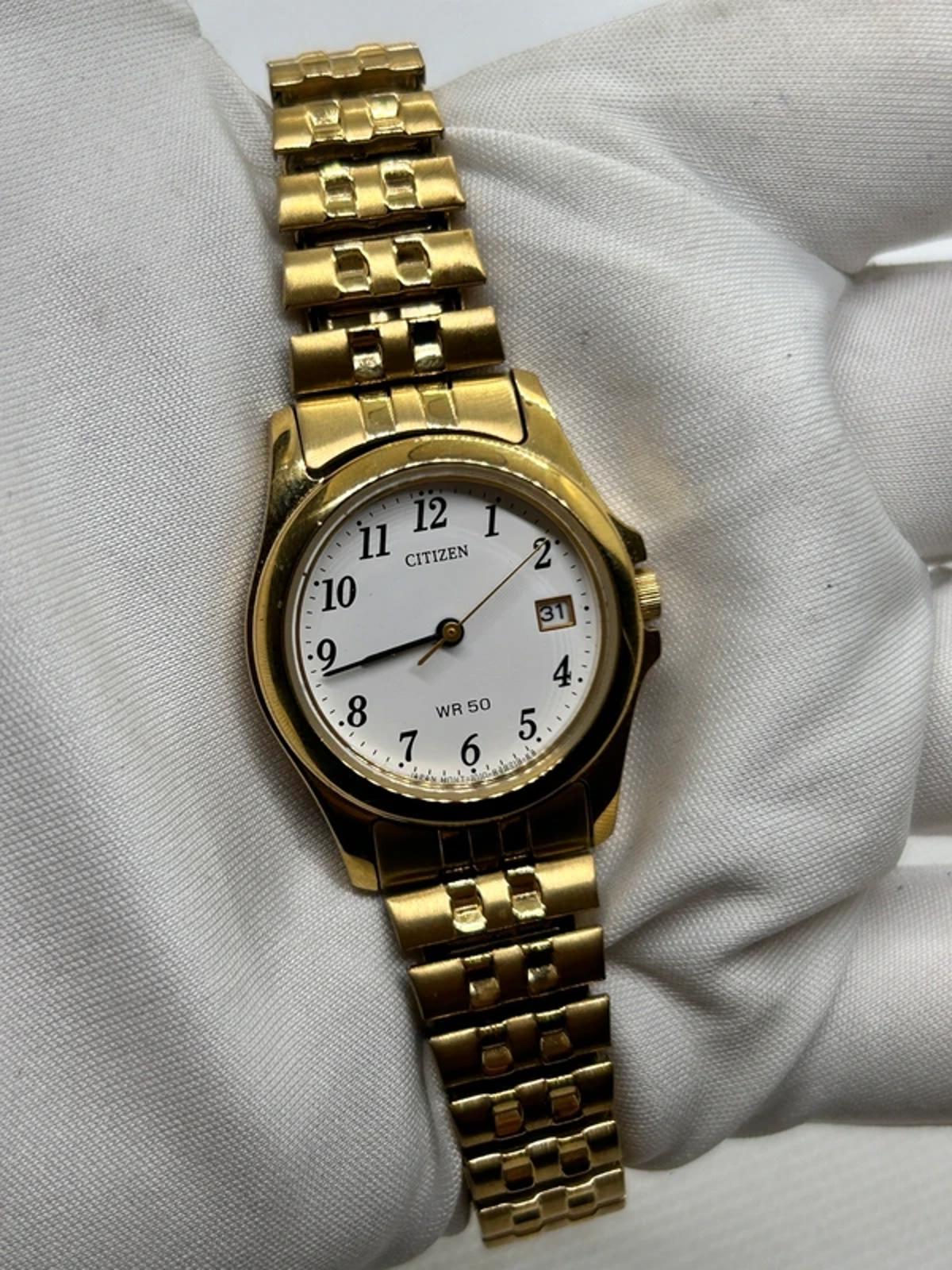 Ladies gold Citizen Watch stretch gold bracelet with white dial