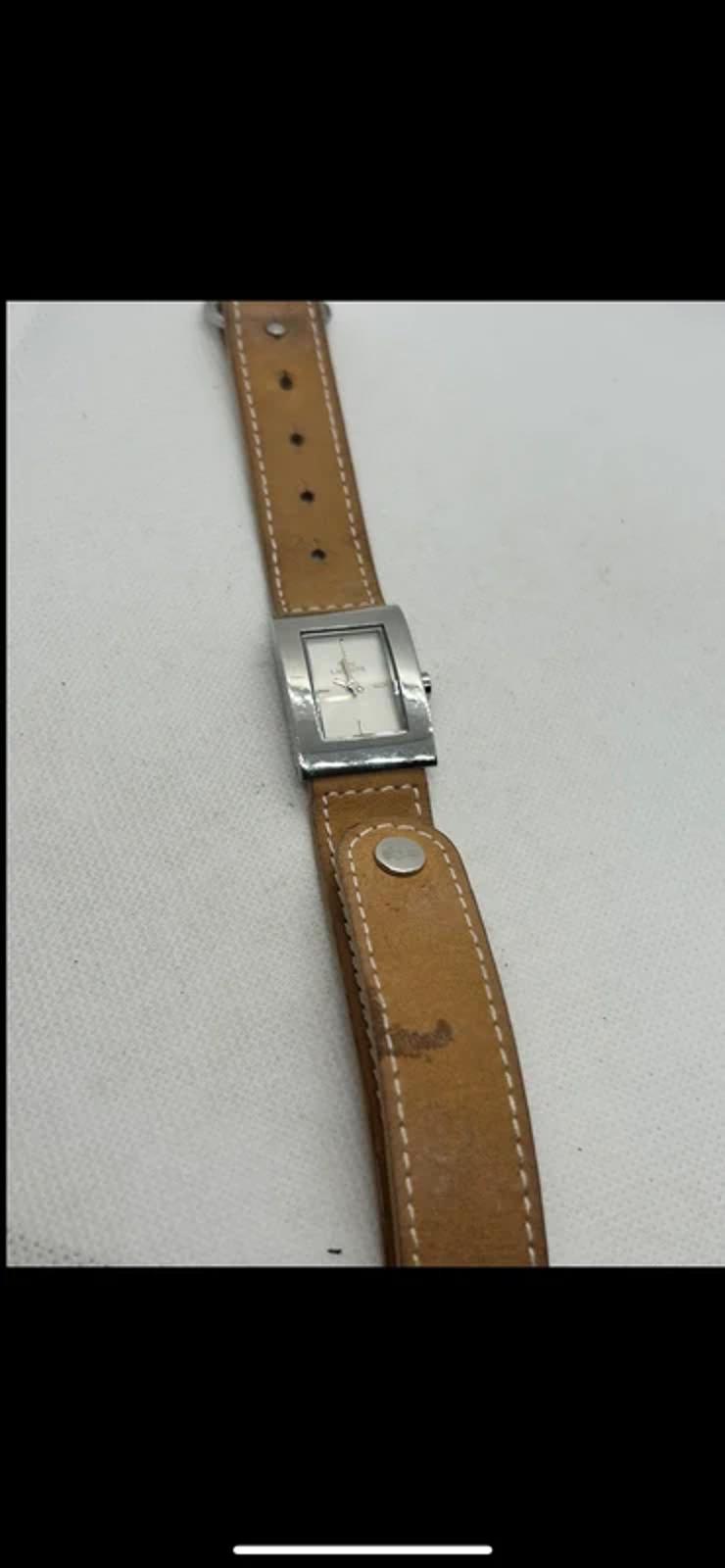 Ladies Lacoste silver case white dial watch with tan suede strap