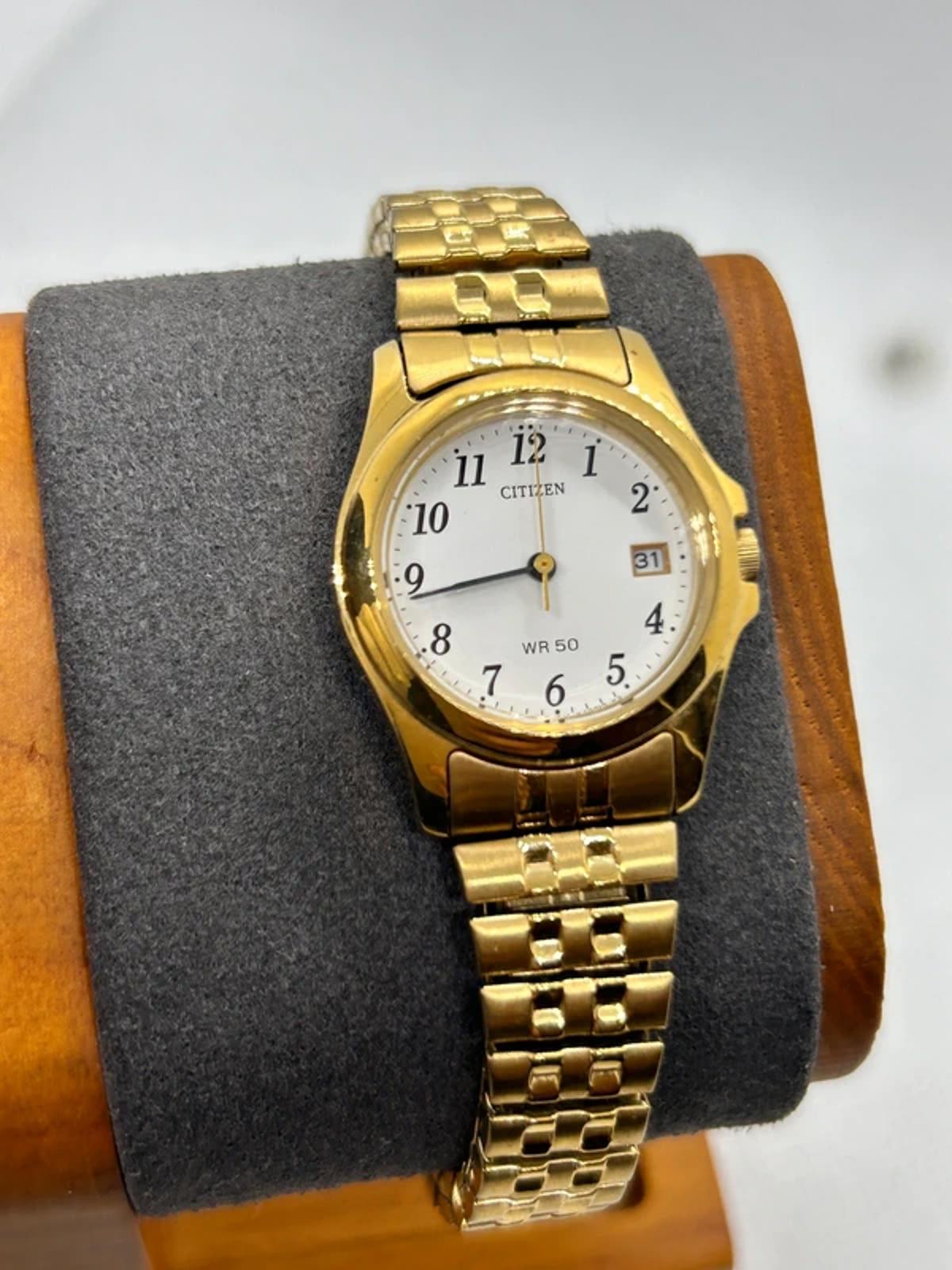 Ladies gold Citizen Watch stretch gold bracelet with white dial