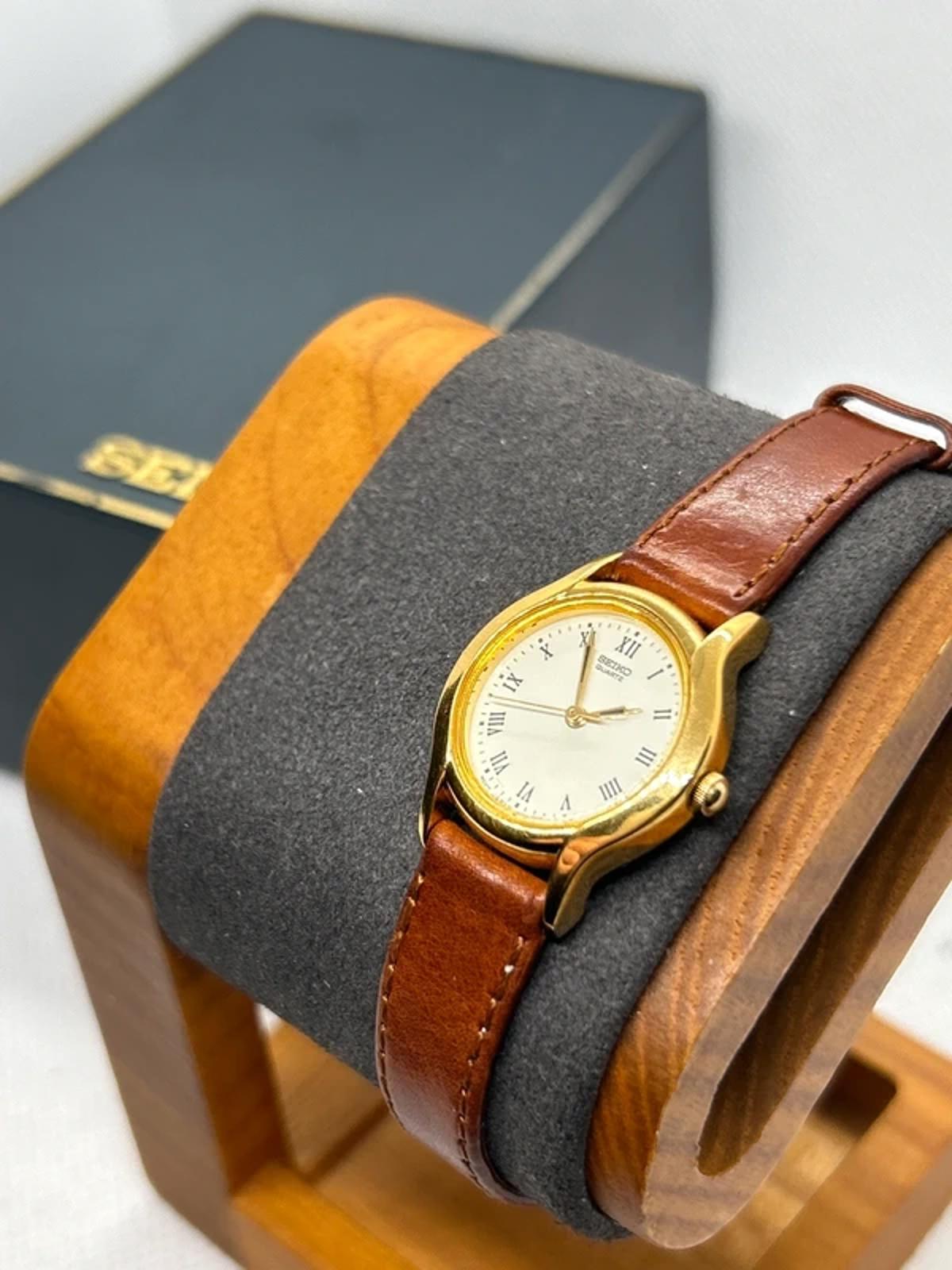 Ladies gold Seiko dress watch with brown leather strap and box