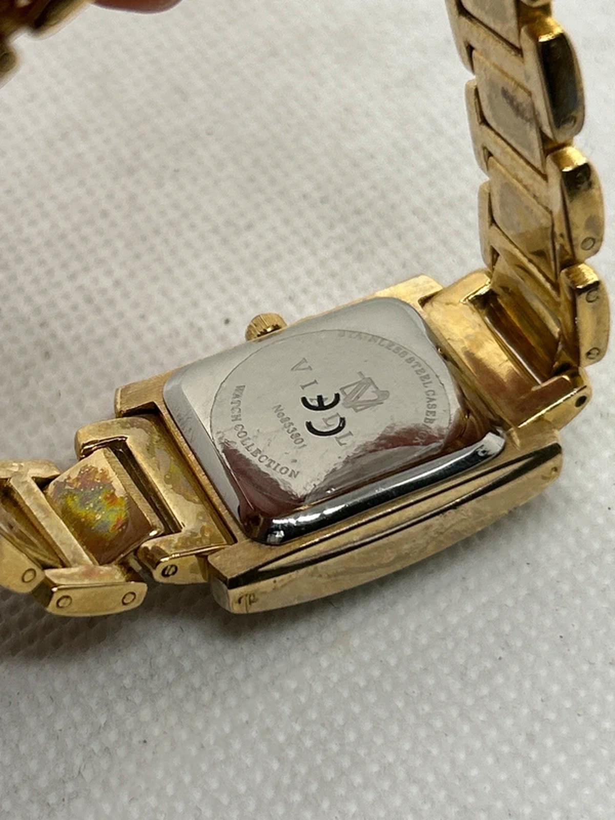 Vialli champagne gold tank watch with patina box and papers