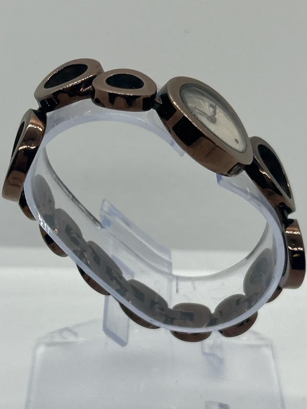 Ladies Fossil bronze bracelet watch waved dial