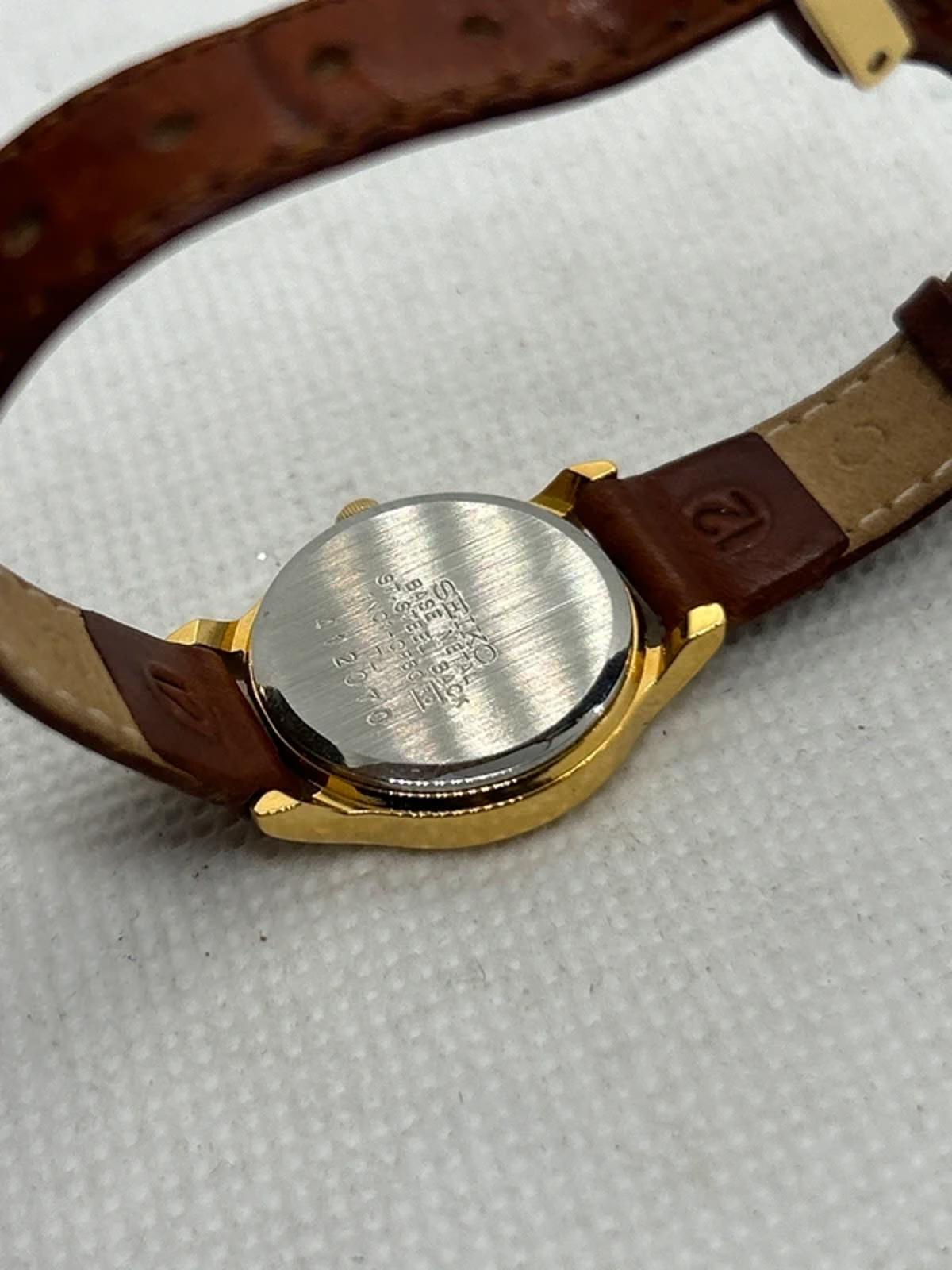 Ladies gold Seiko dress watch with brown leather strap and box