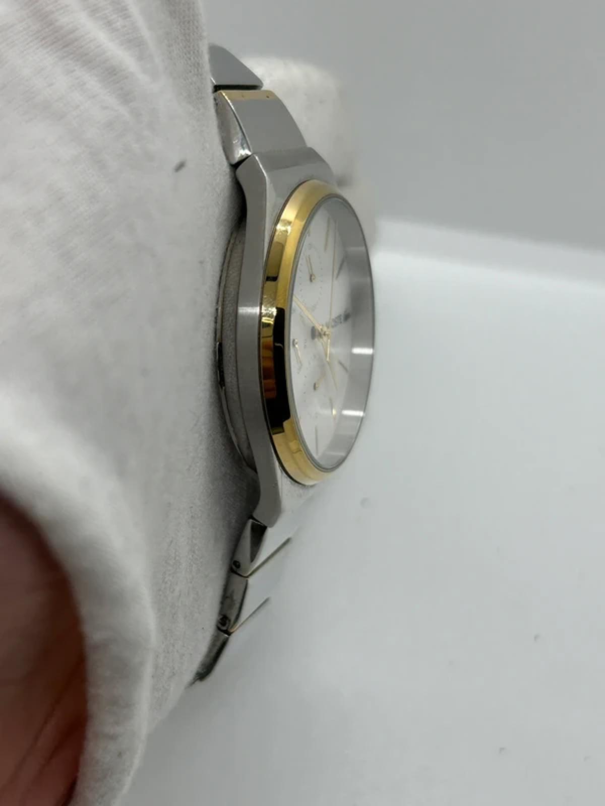 Ladies Lacoste silver and gold watch with box and papers
