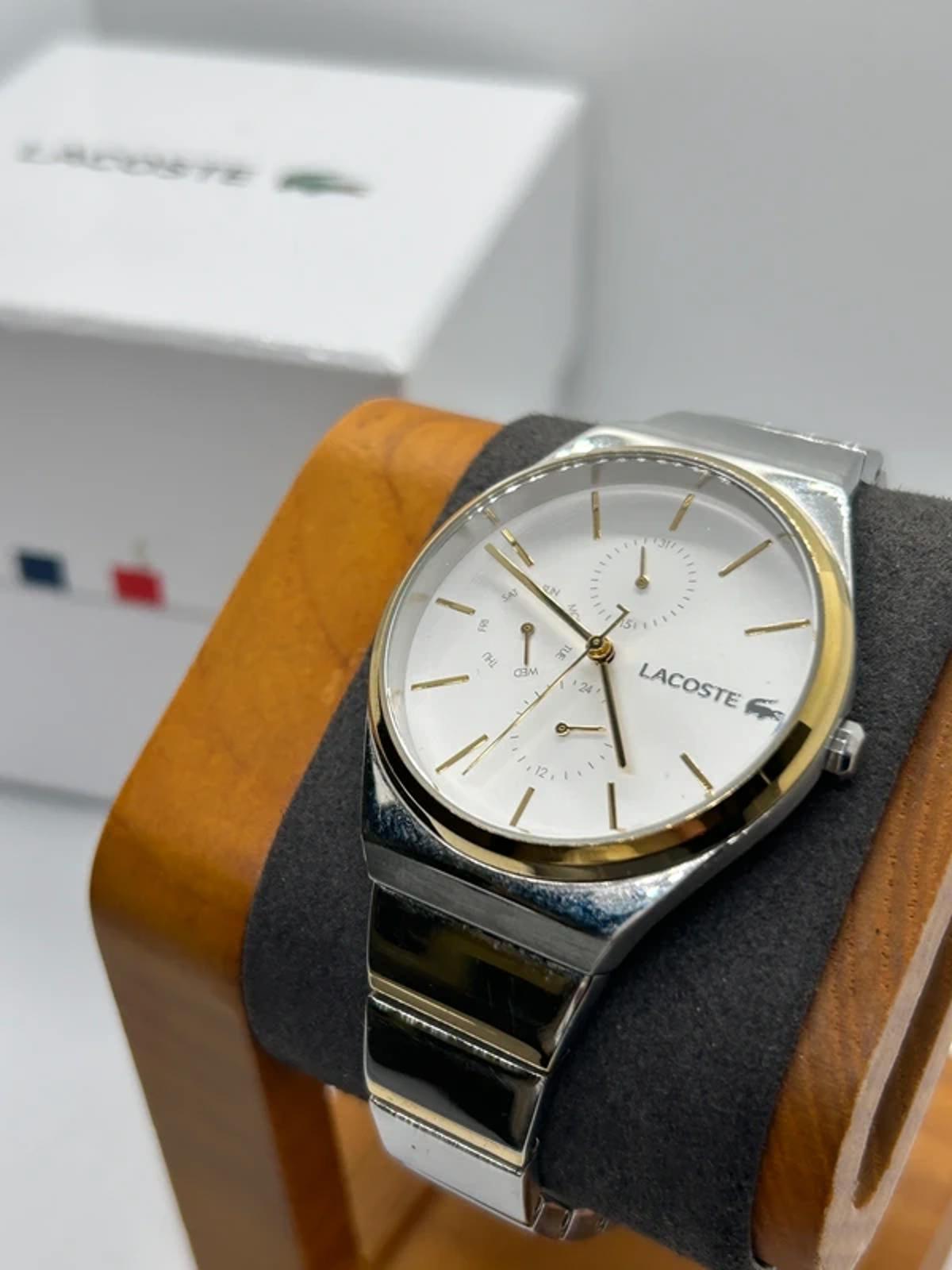 Ladies Lacoste silver and gold watch with box and papers