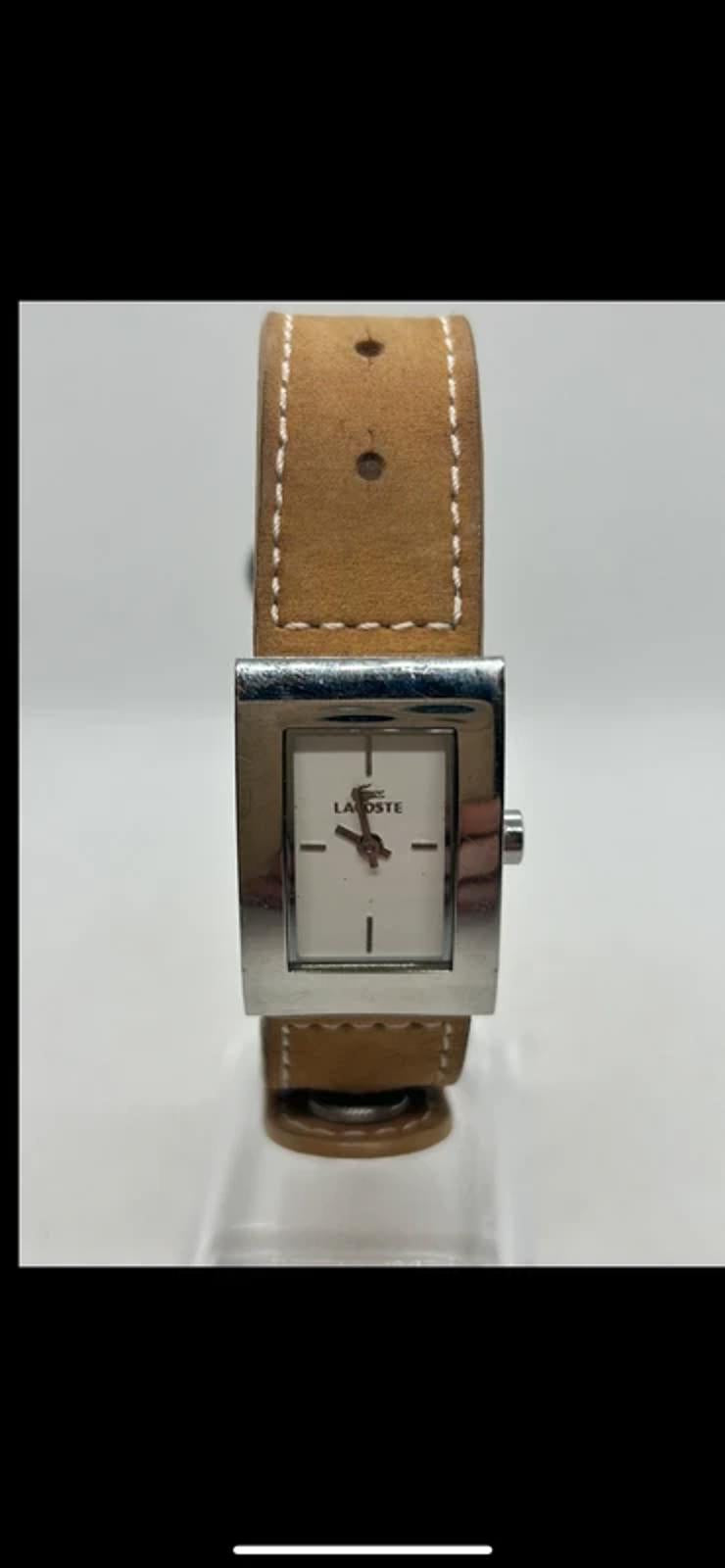 Ladies Lacoste silver case white dial watch with tan suede strap