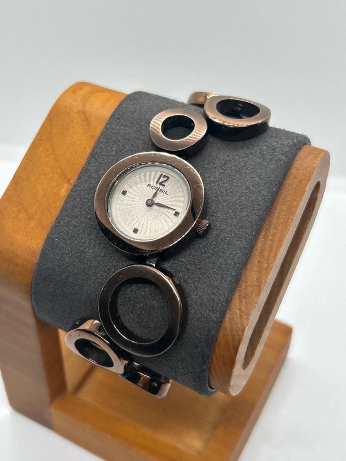Ladies Fossil bronze bracelet watch waved dial