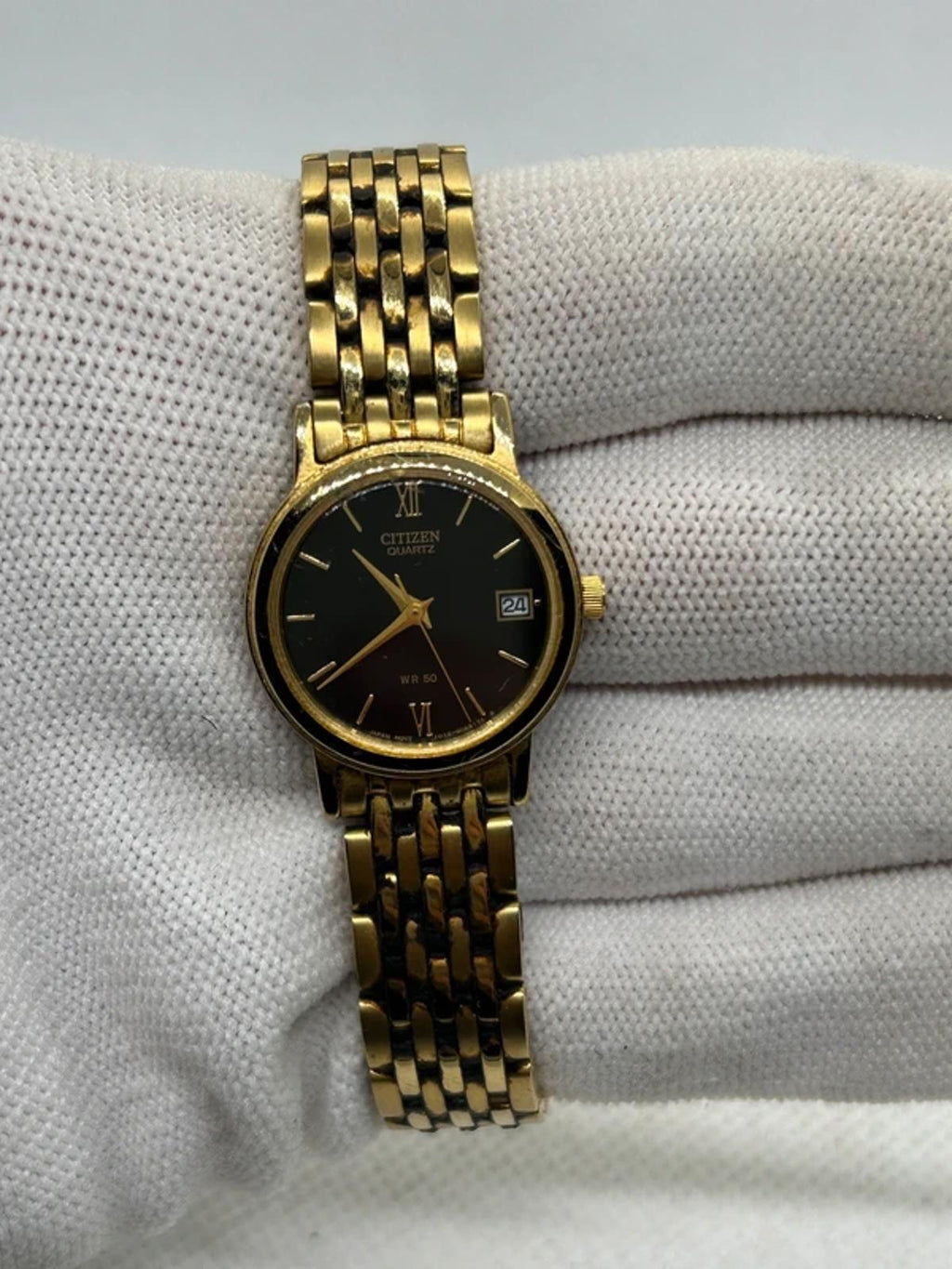 Ladies Citizen gold quartz detach with black dial dress watch