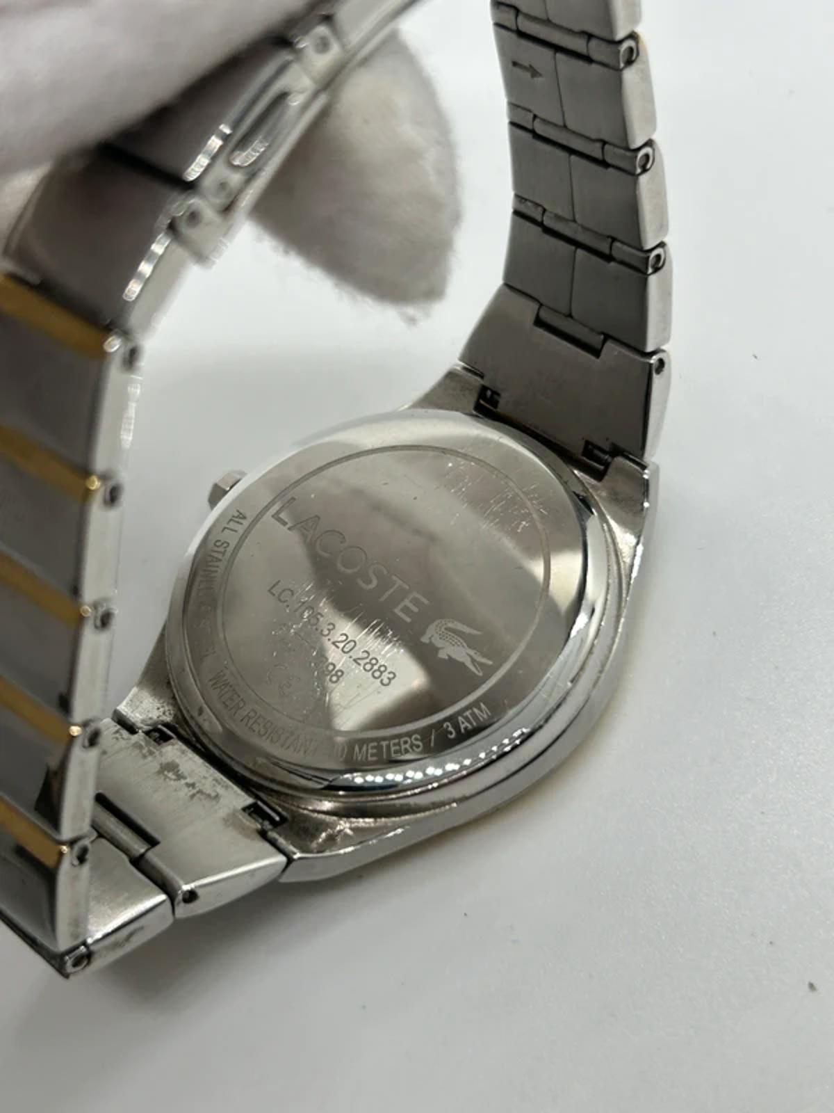 Ladies Lacoste silver and gold watch with box and papers