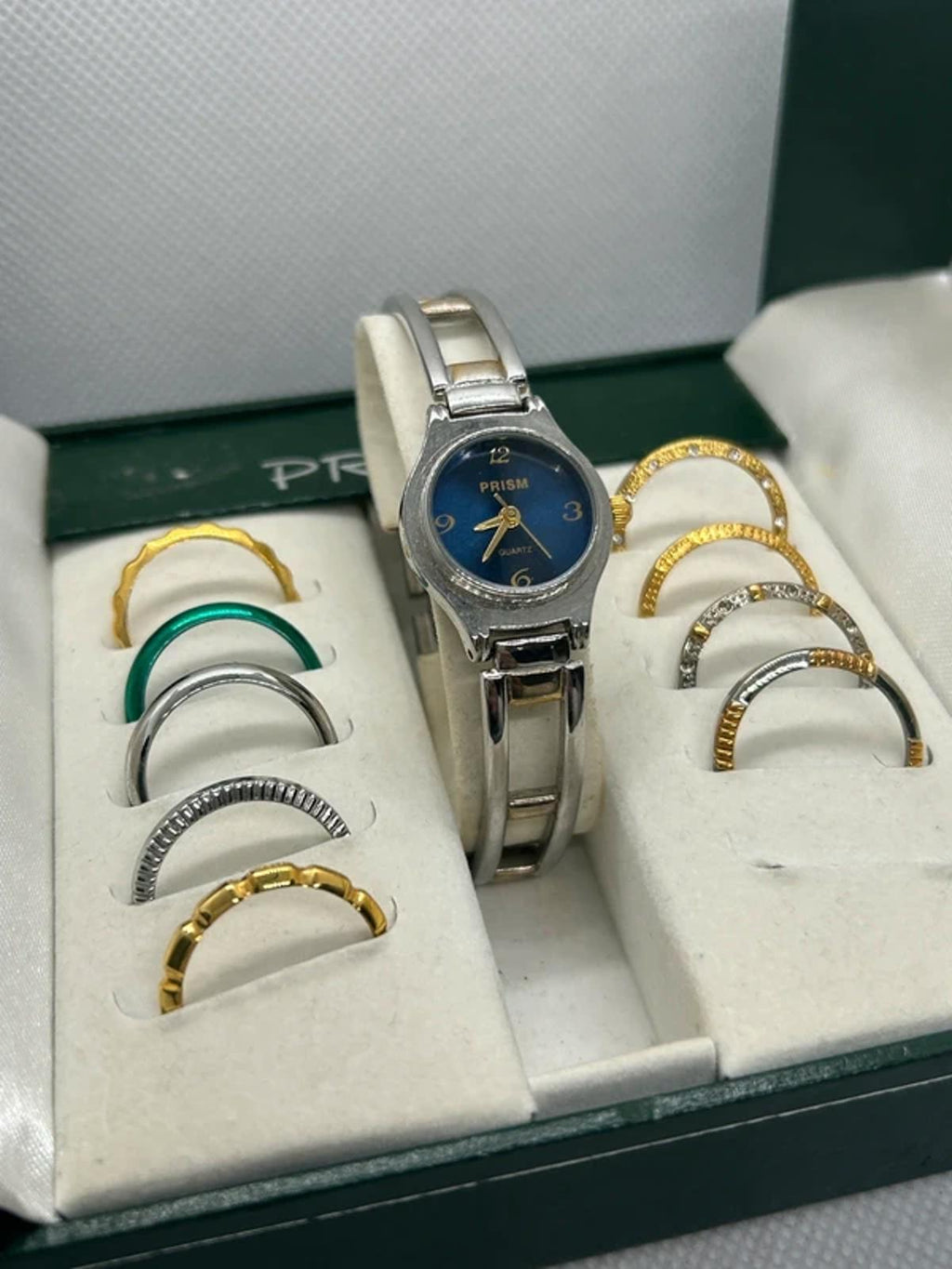 Ladies gold and silver Prism watch changeable bezel watch with box