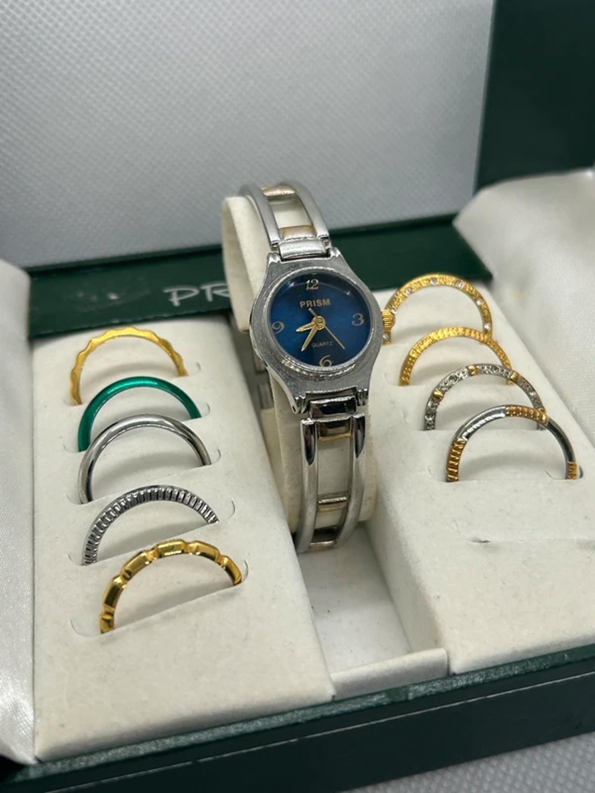 Ladies gold and silver Prism watch changeable bezel watch with box