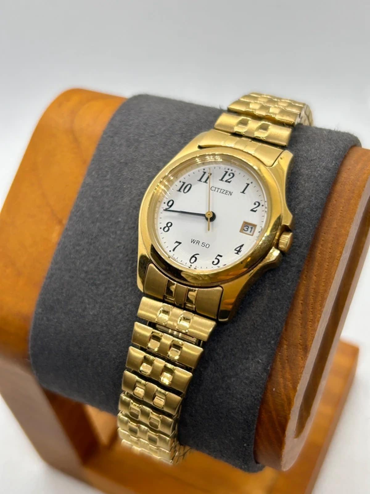 Ladies gold Citizen Watch stretch gold bracelet with white dial