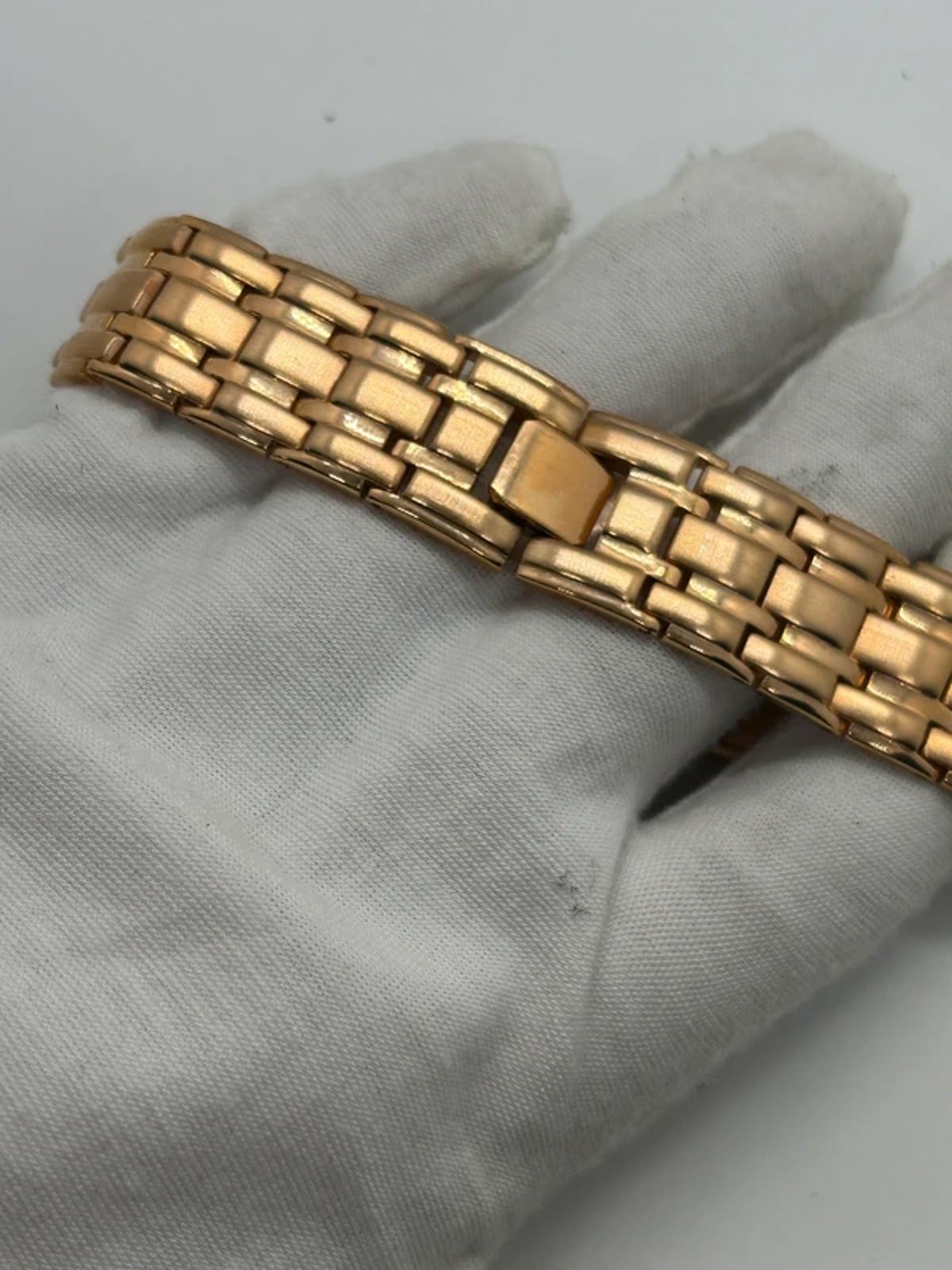 Ladies Copperfield gold case watch and bracket with white dial