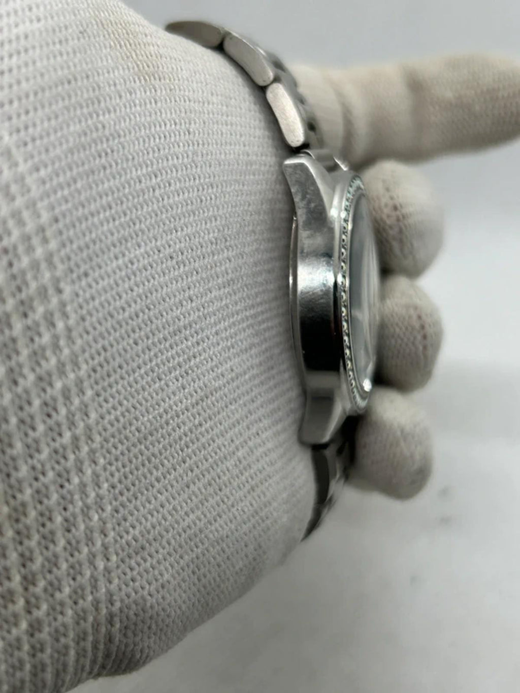 Ladies silver Guess watch diamanté bezel with silver dial and silver bracelet
