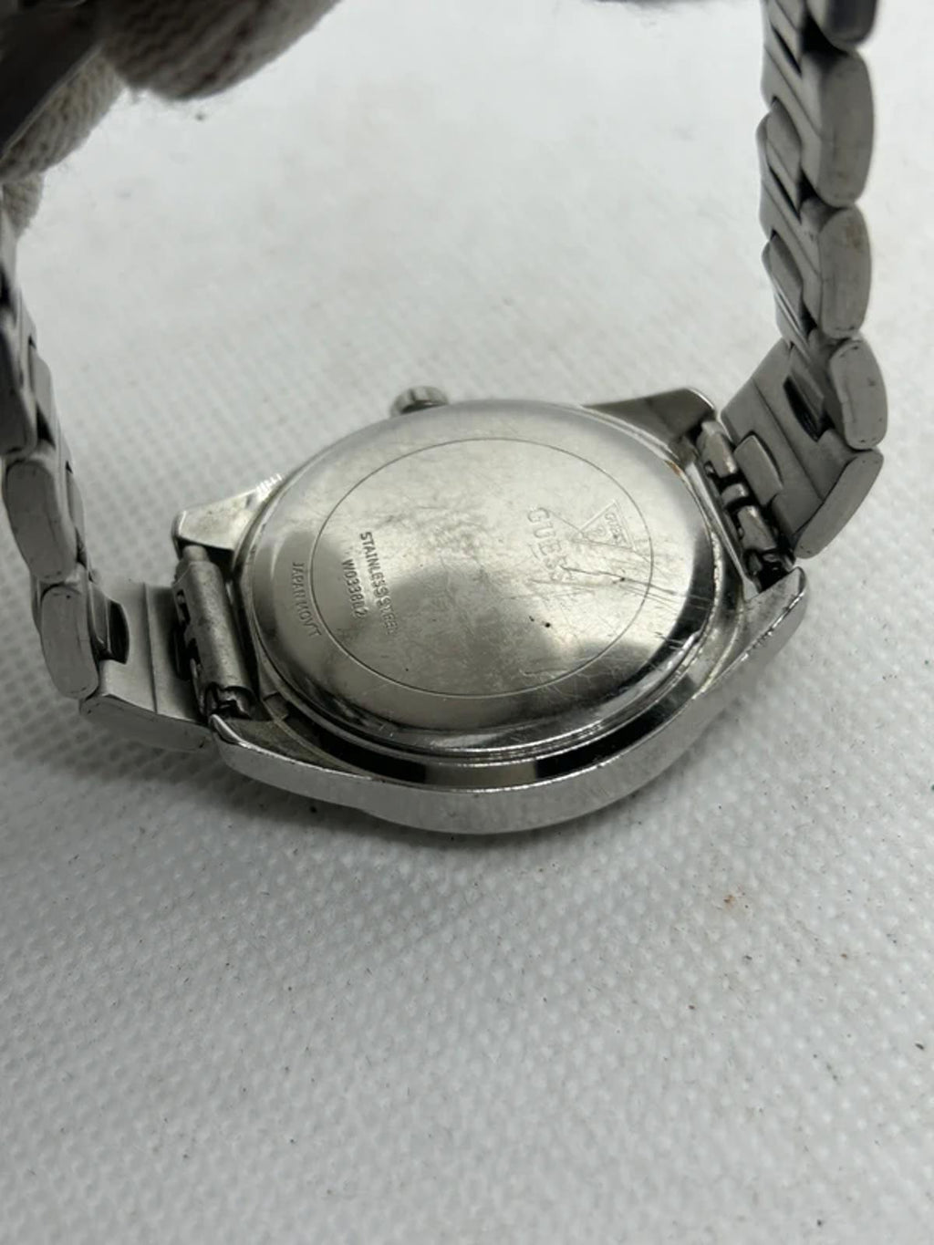 Ladies silver Guess watch diamanté bezel with silver dial and silver bracelet