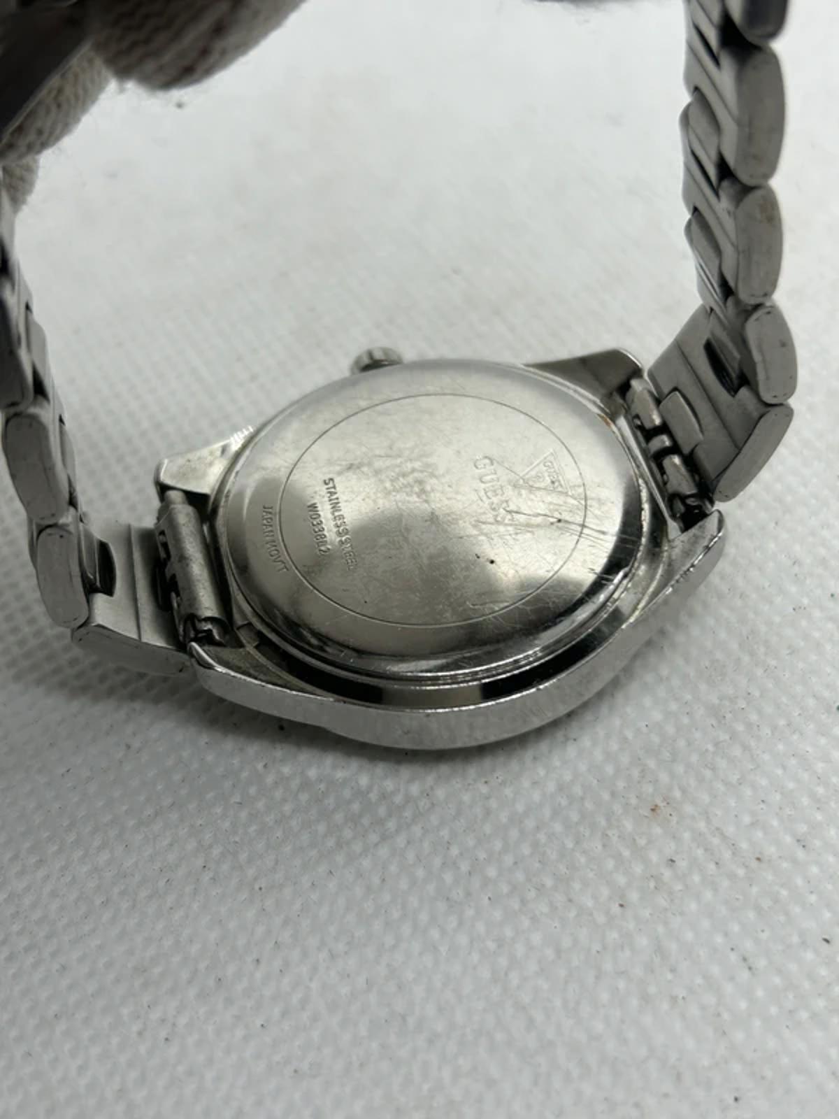 Ladies silver Guess watch diamanté bezel with silver dial and silver bracelet