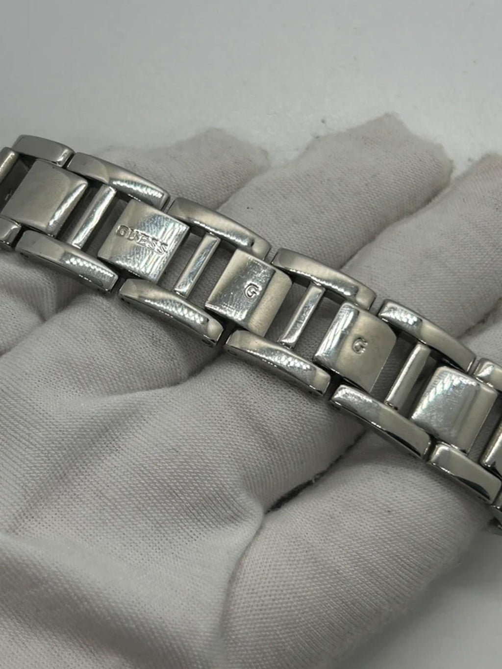 Guess ladies silver tank watch black dial with box and papers