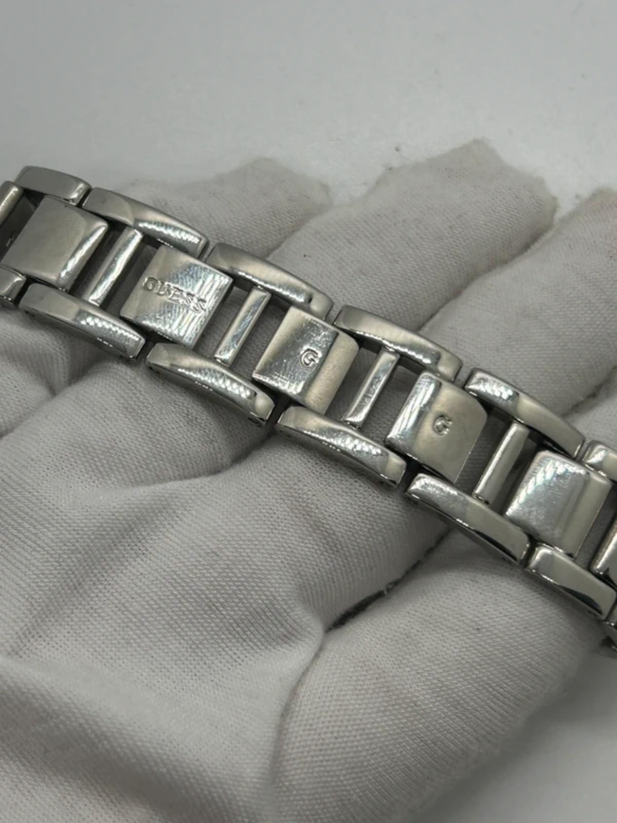 Guess ladies silver tank watch black dial with box and papers