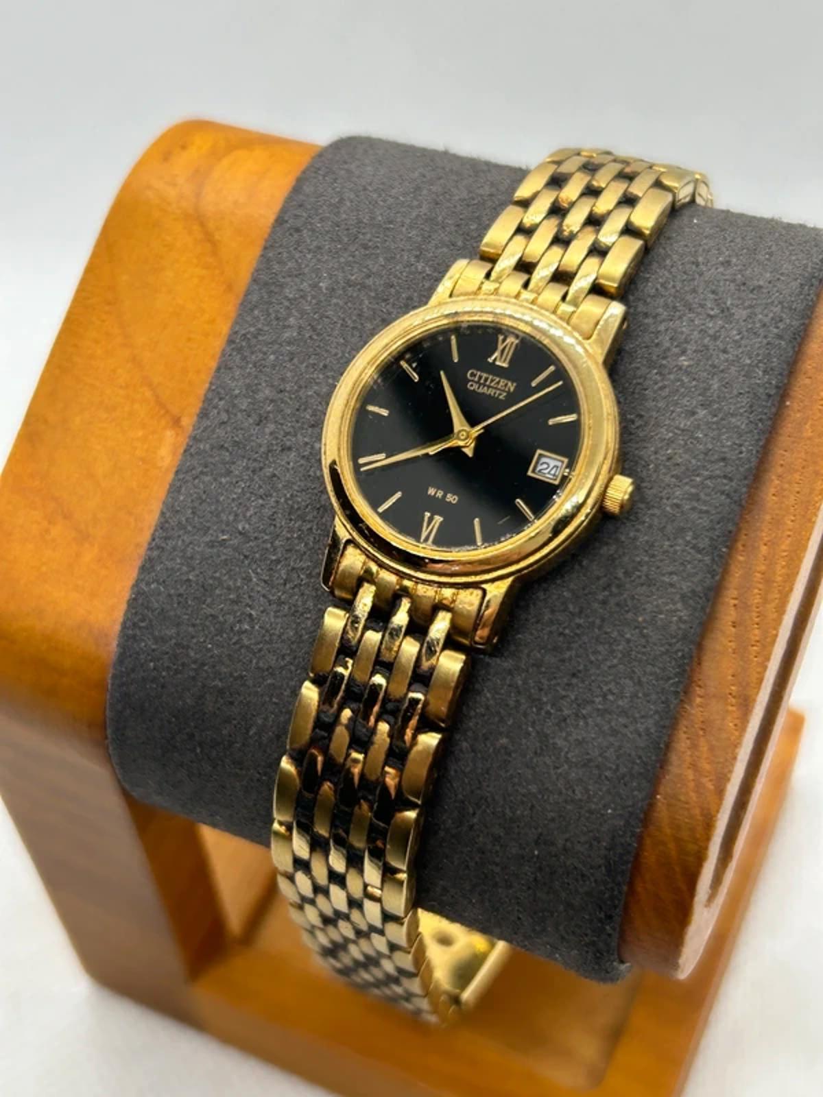 Ladies Citizen gold quartz detach with black dial dress watch