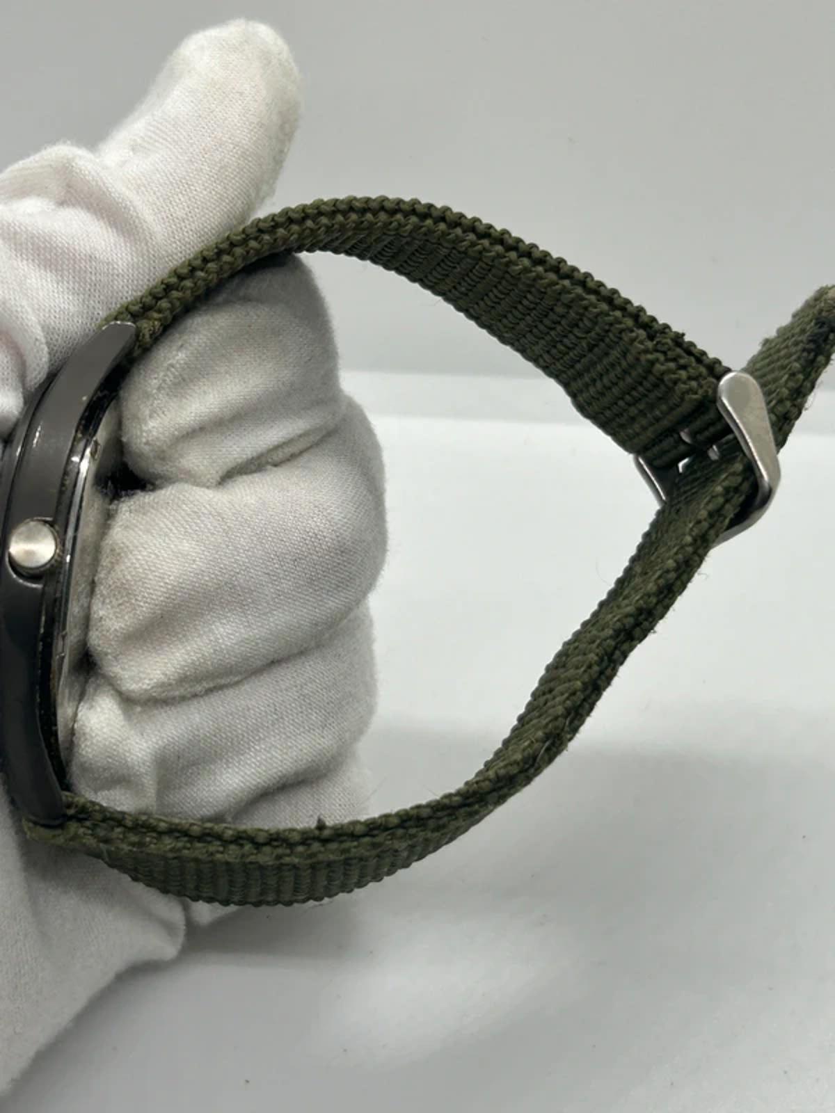 Zeiger sports watch with black case green dial and green fabric strap