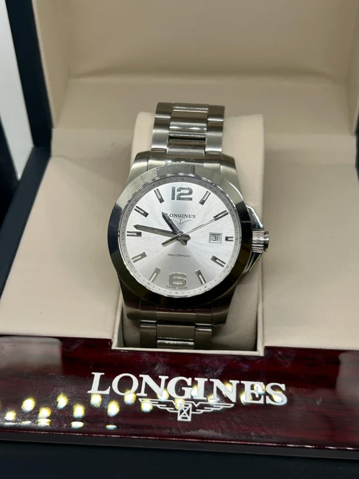 Longines conquest quartz watch  box and manual