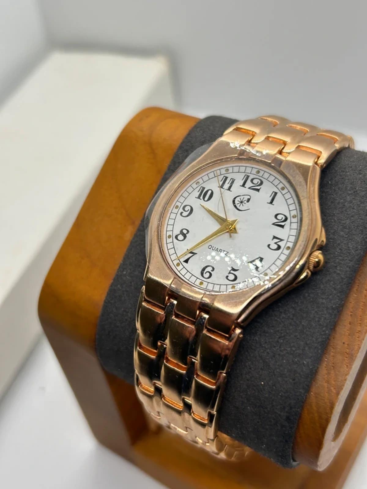 Ladies Copperfield gold case watch and bracket with white dial