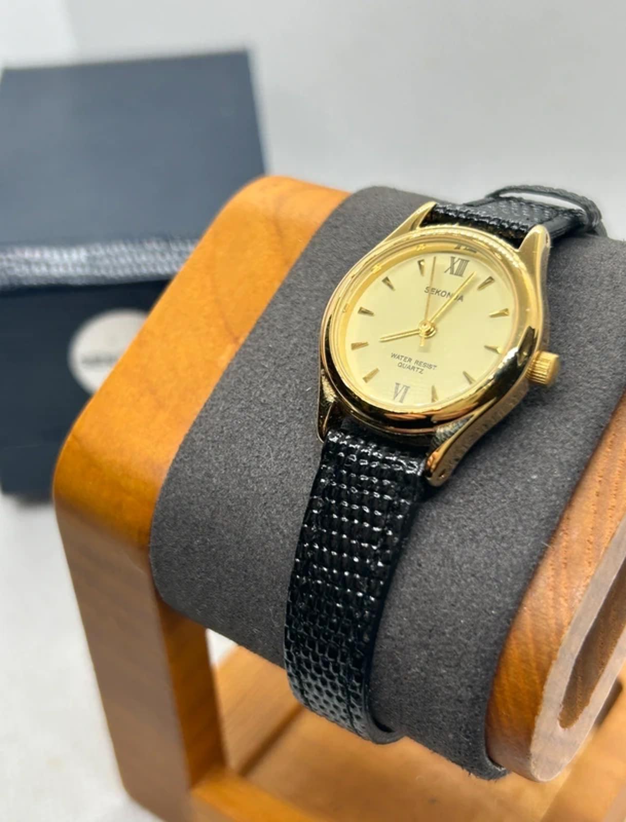 Ladies gold Sekonda case and dial with black strap with box
