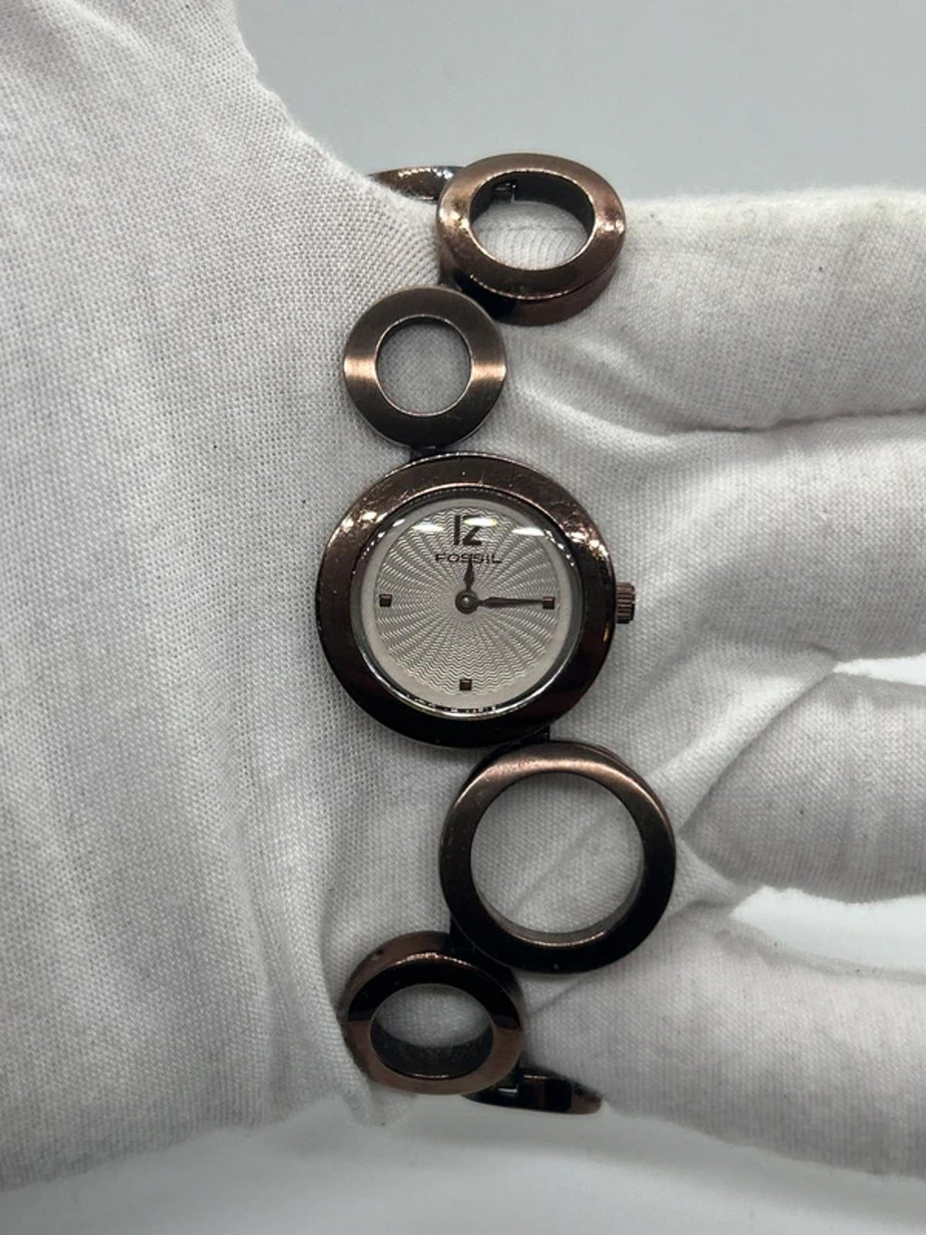Ladies Fossil bronze bracelet watch waved dial