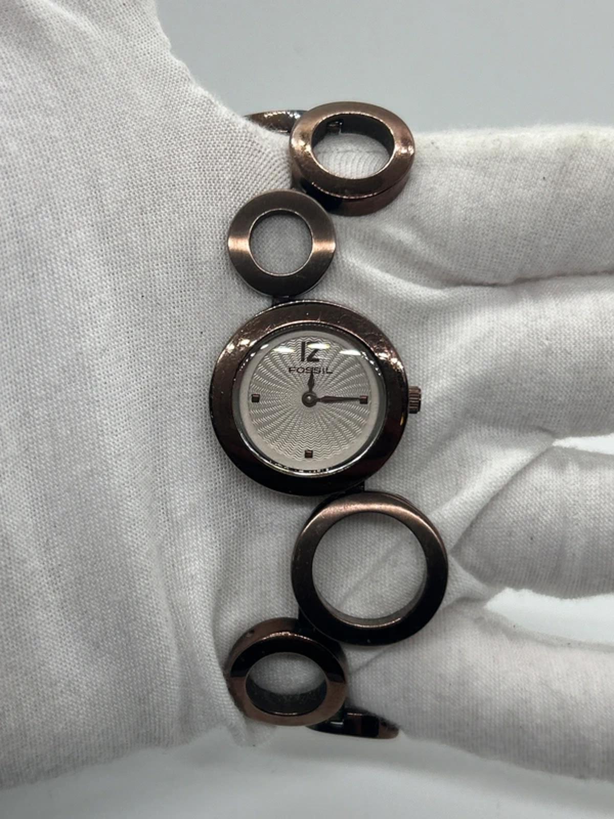 Ladies Fossil bronze bracelet watch waved dial