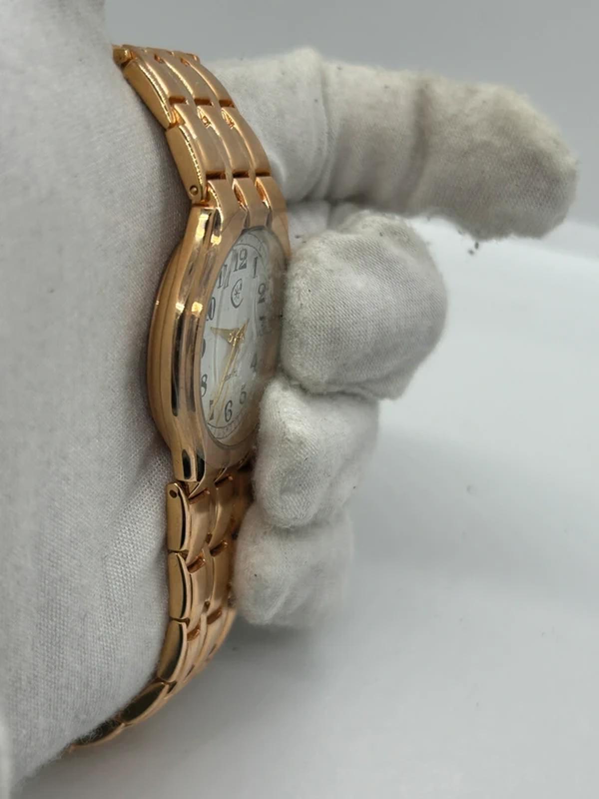 Ladies Copperfield gold case watch and bracket with white dial