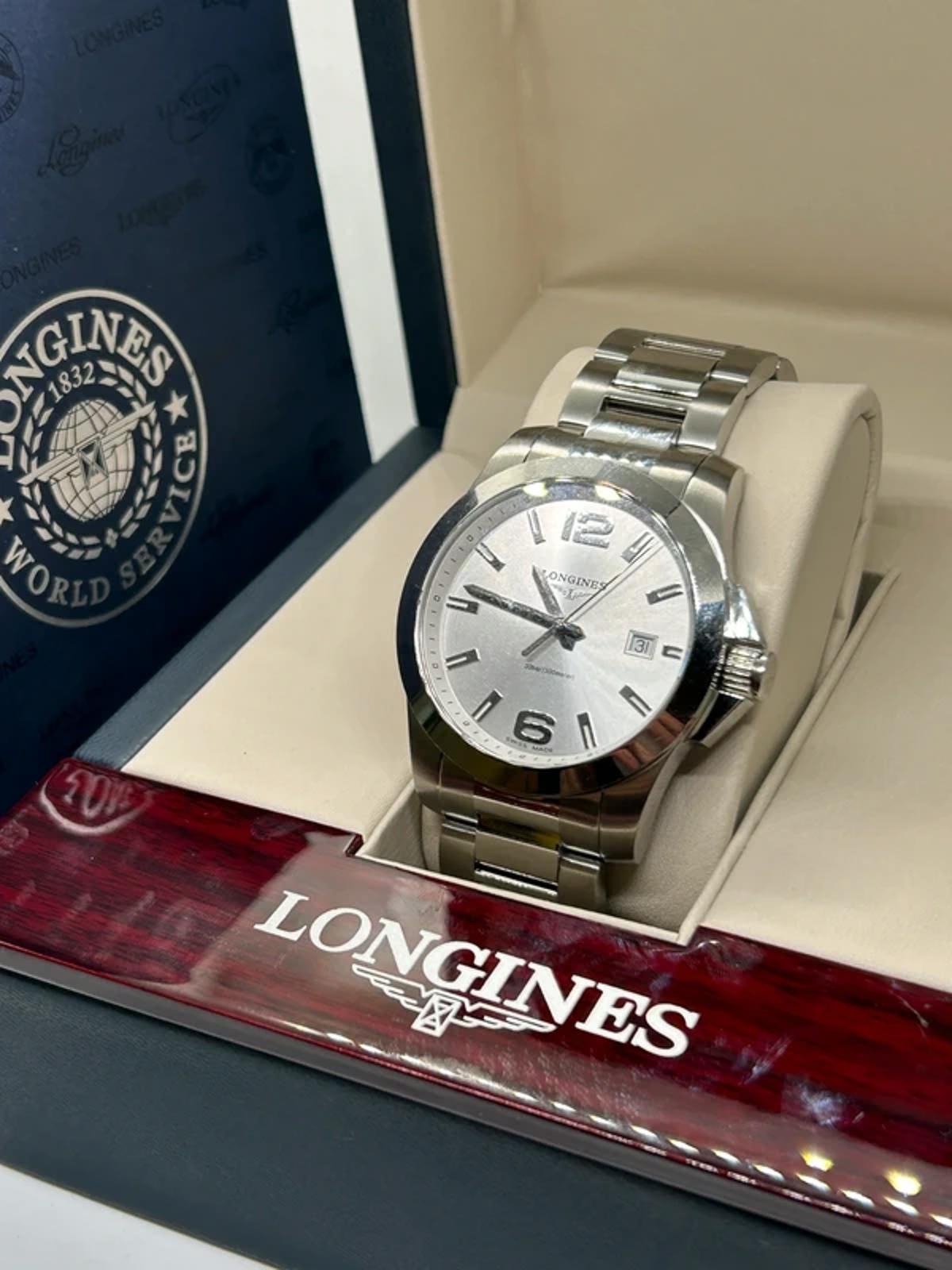 Longines conquest quartz watch  box and manual