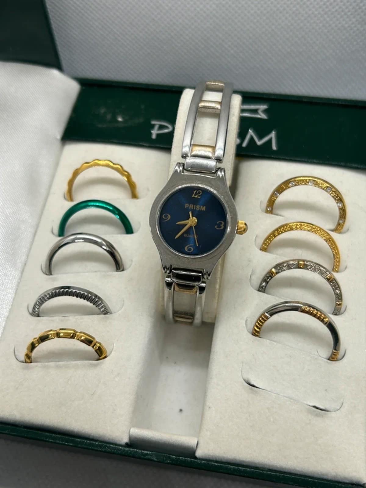 Ladies gold and silver Prism watch changeable bezel watch with box