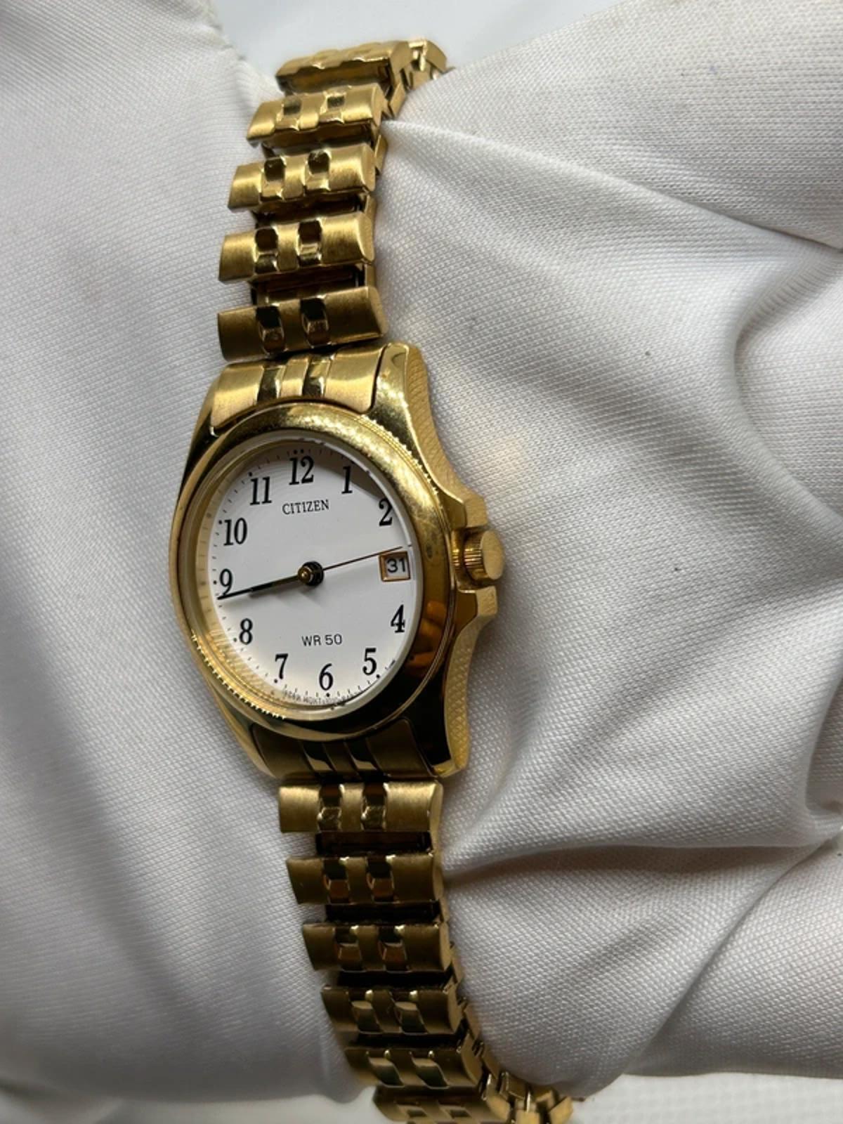 Ladies gold Citizen Watch stretch gold bracelet with white dial