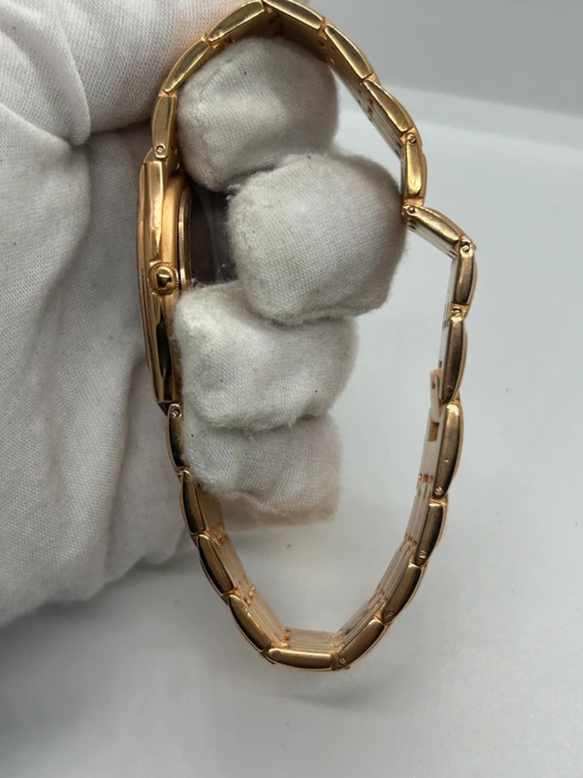 Ladies Copperfield gold case watch and bracket with white dial