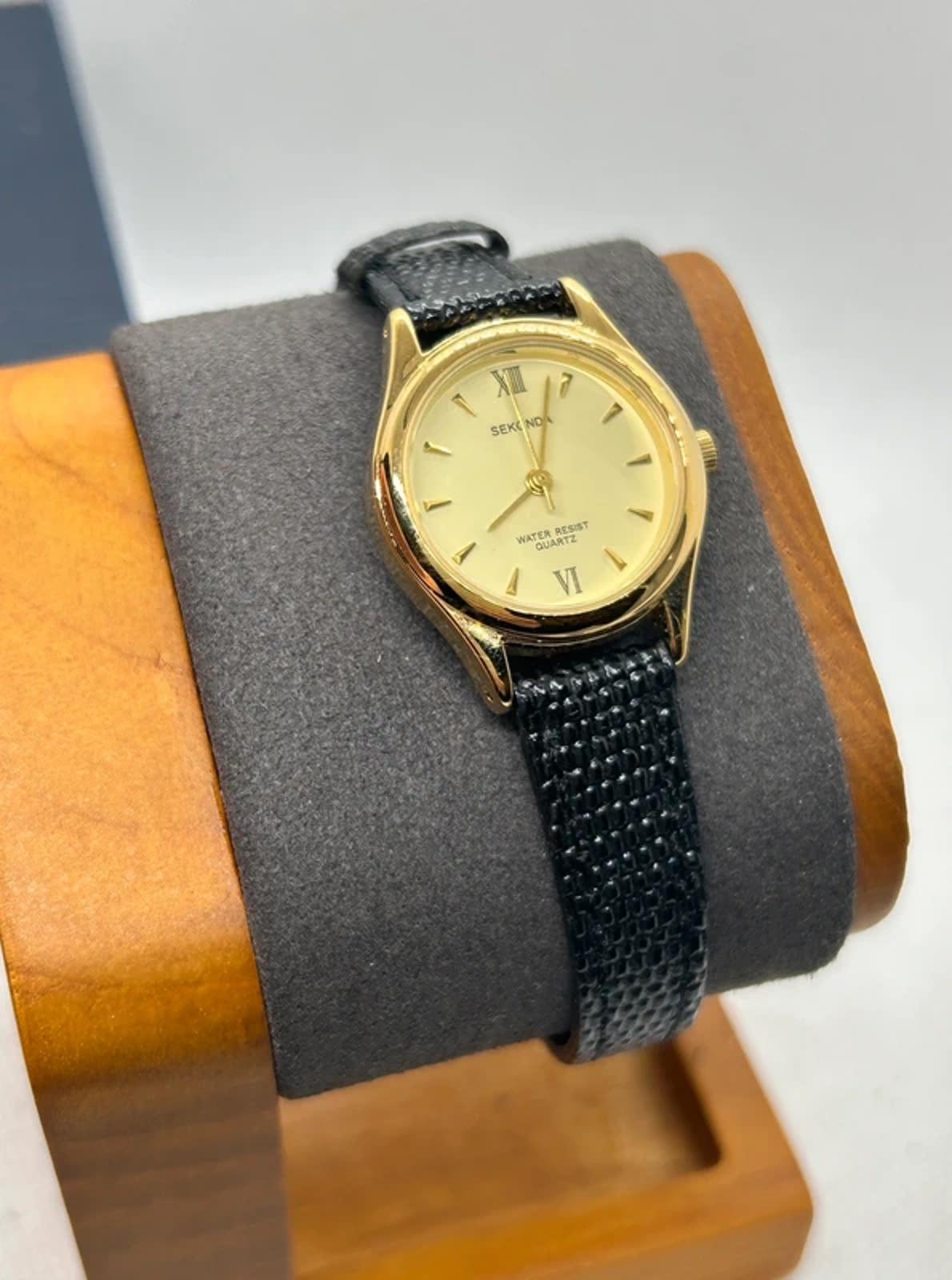 Ladies gold Sekonda case and dial with black strap with box