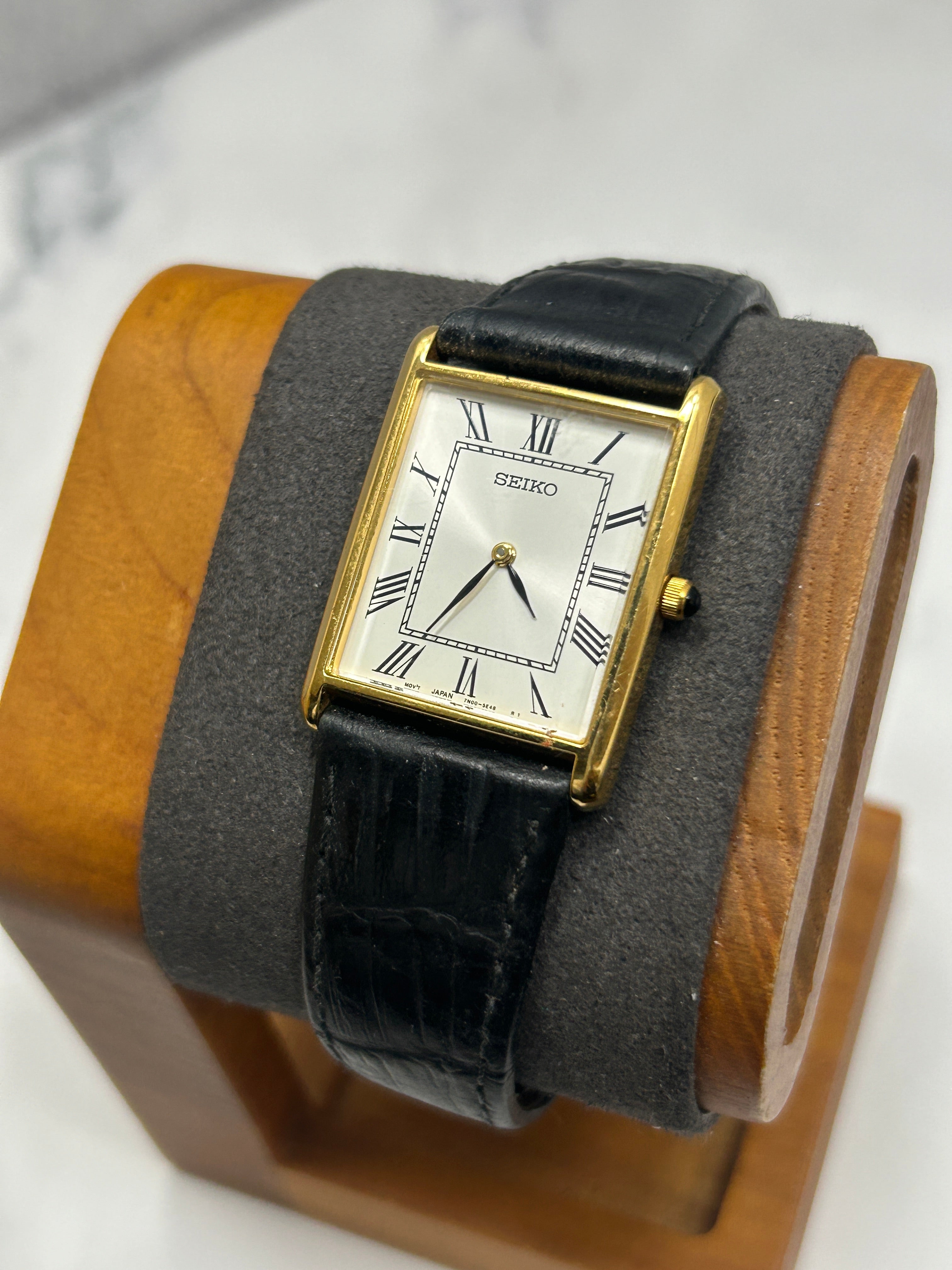 Vintage Seiko gold case tank watch white dial black strap