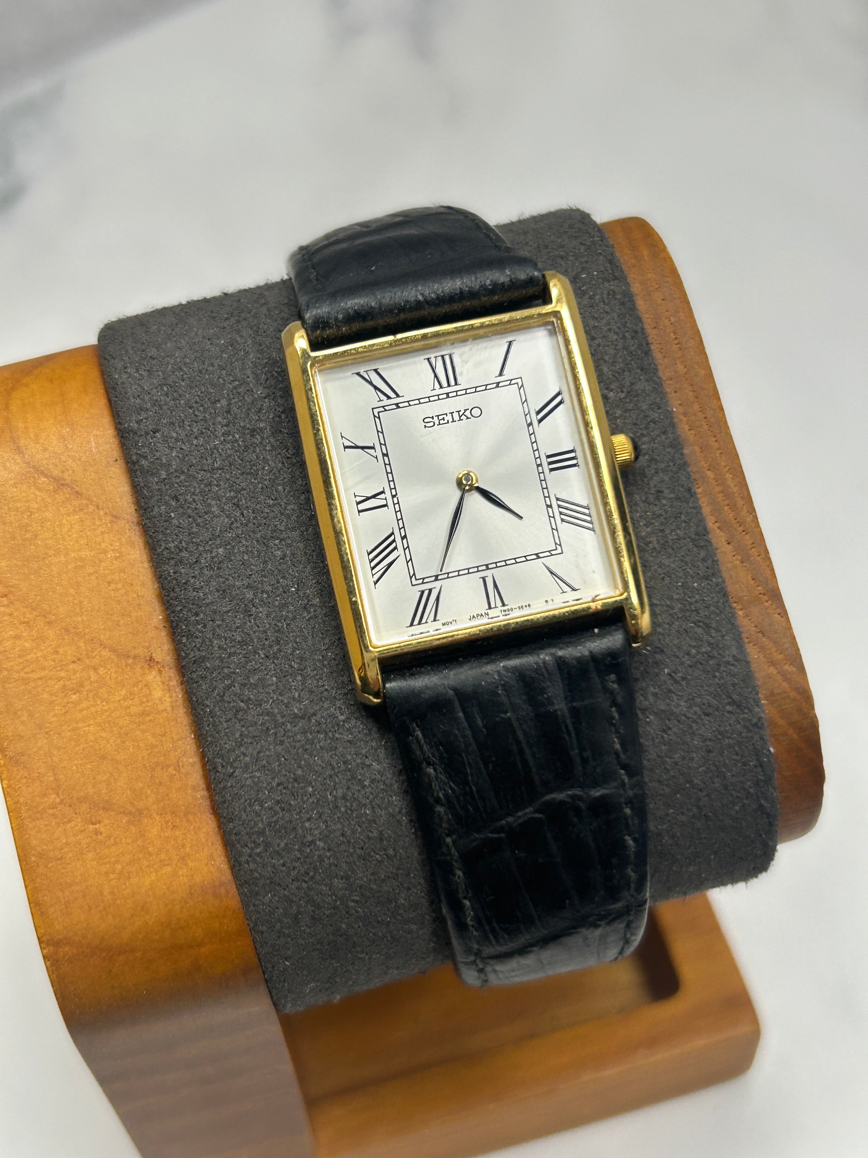 Vintage Seiko gold case tank watch white dial black strap