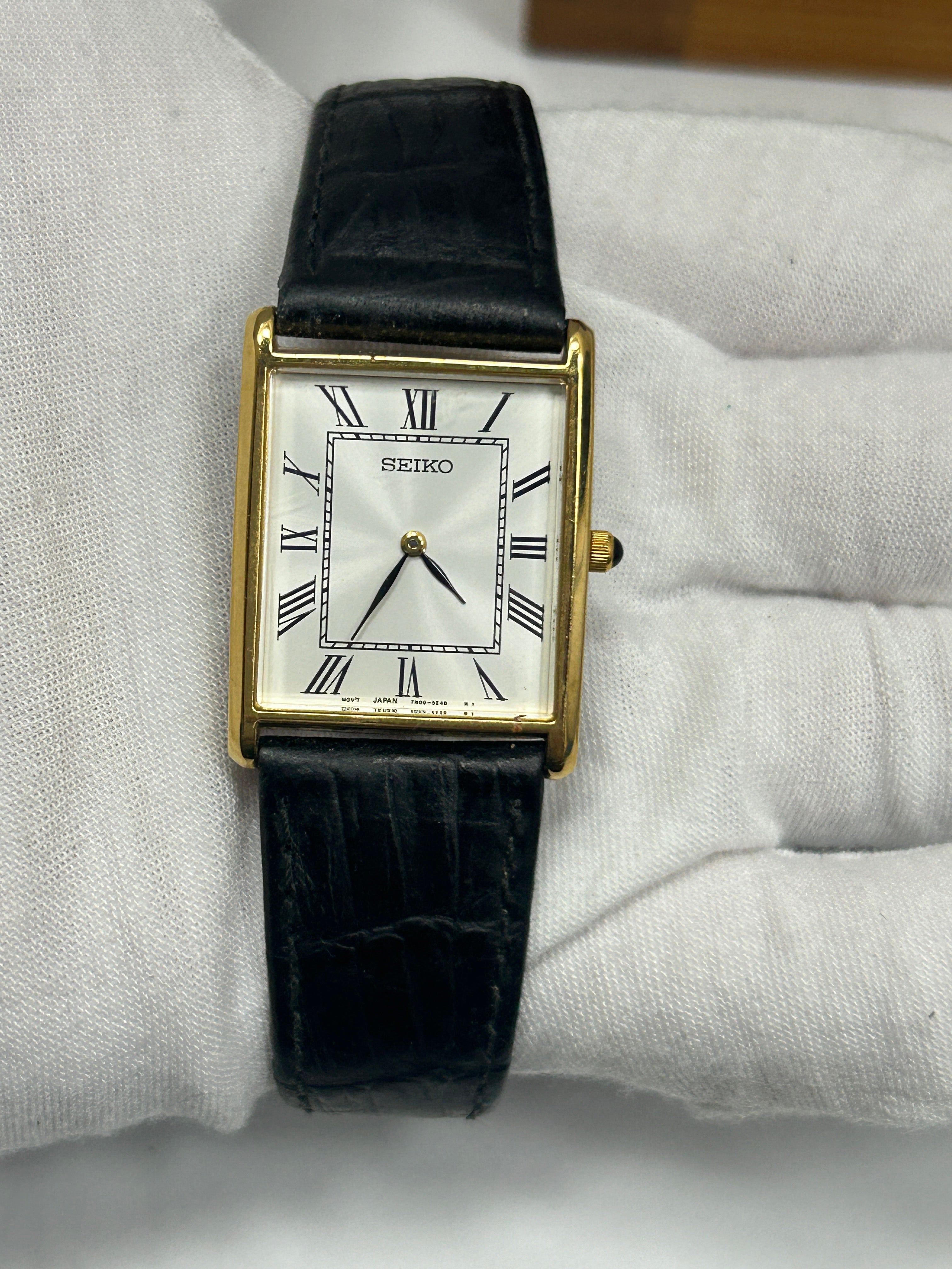 Vintage Seiko gold case tank watch white dial black strap