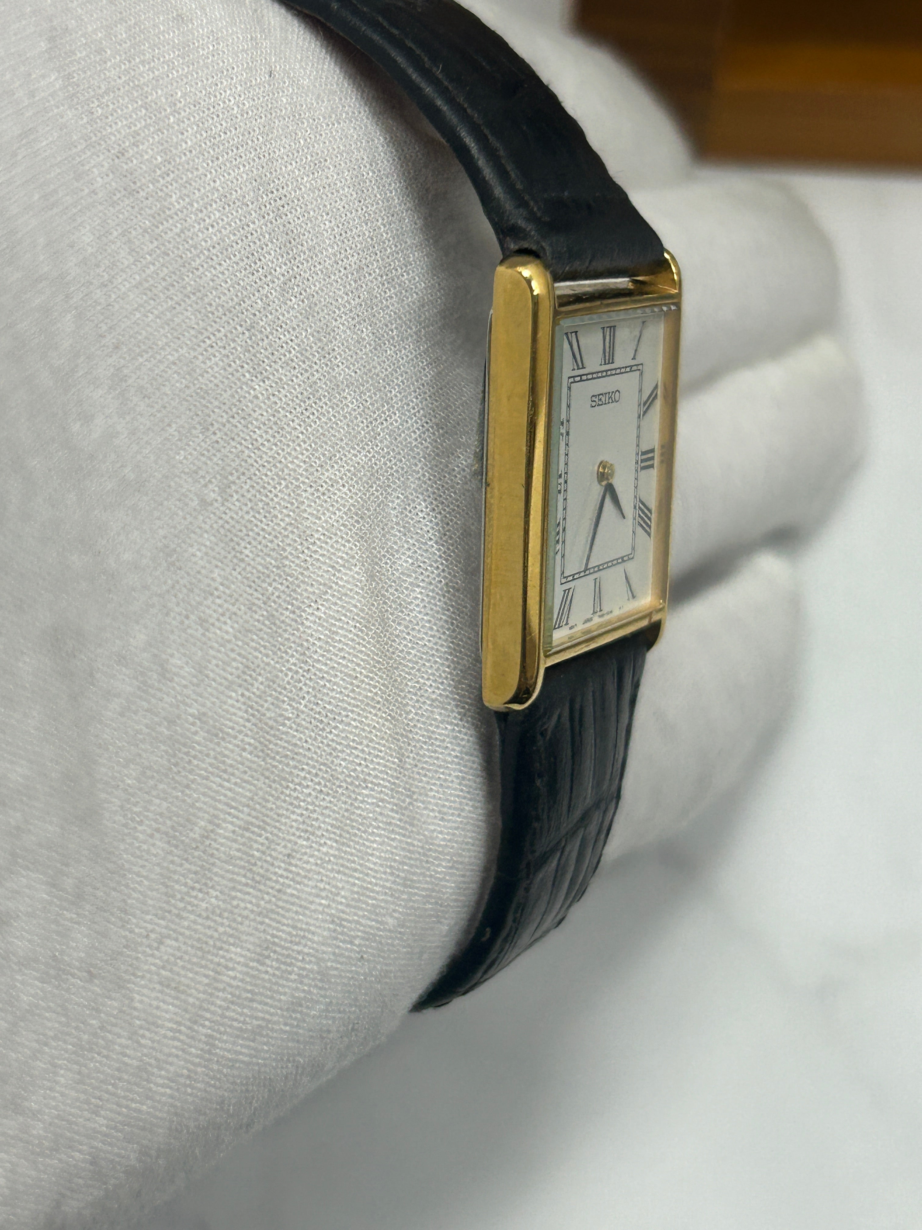 Vintage Seiko gold case tank watch white dial black strap