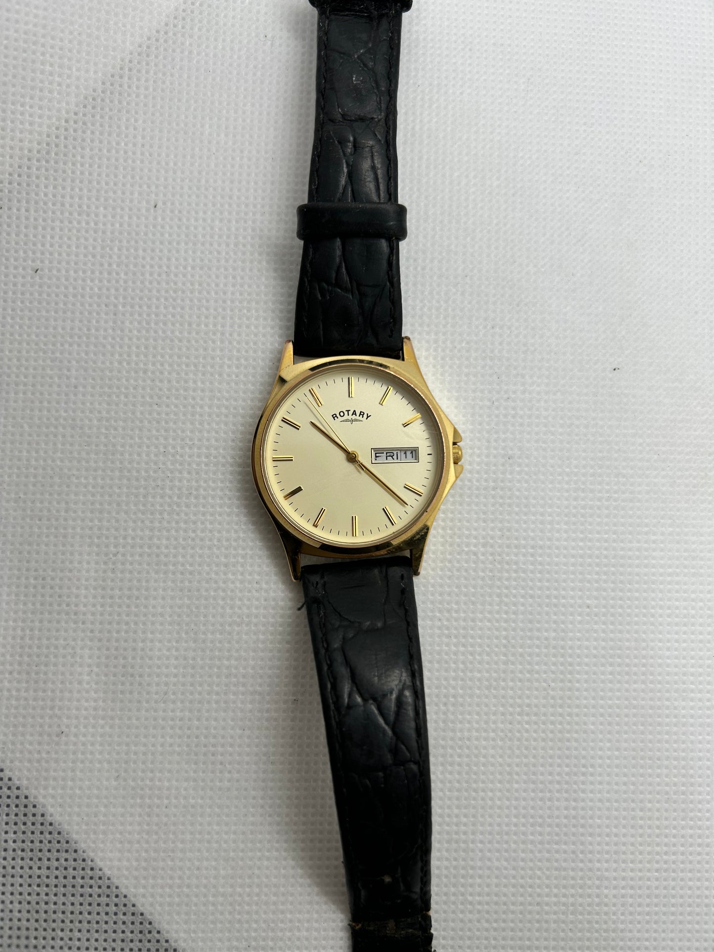 Rotary watch gold dial with day date function