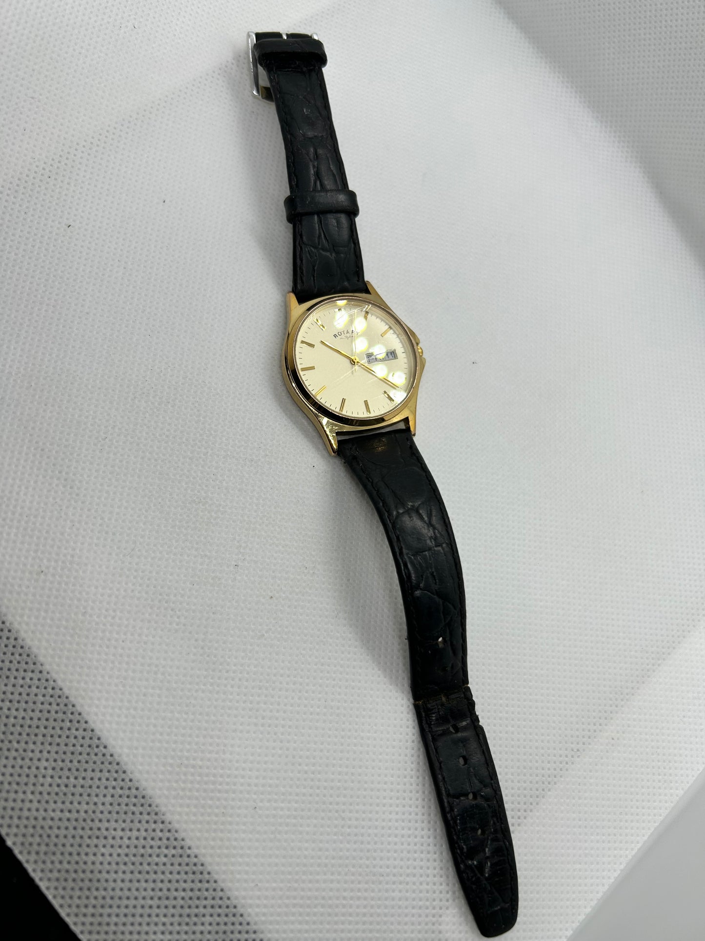 Rotary watch gold dial with day date function