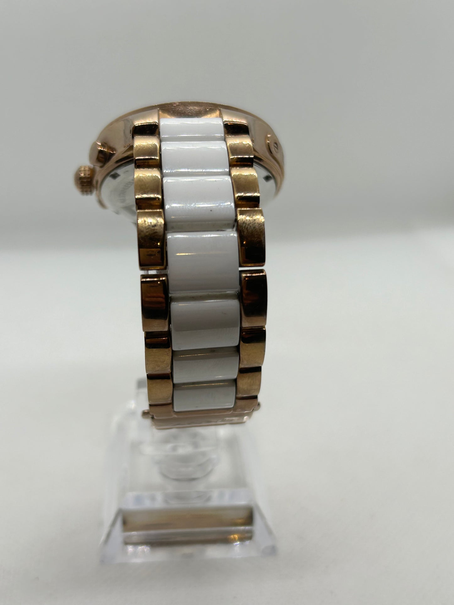 DKNY Ladies quartz watch rose gold and white with “diamond” features and date function