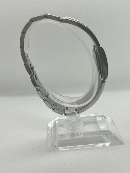 DKNY silver quartz bangle watch with “diamond” style bangle