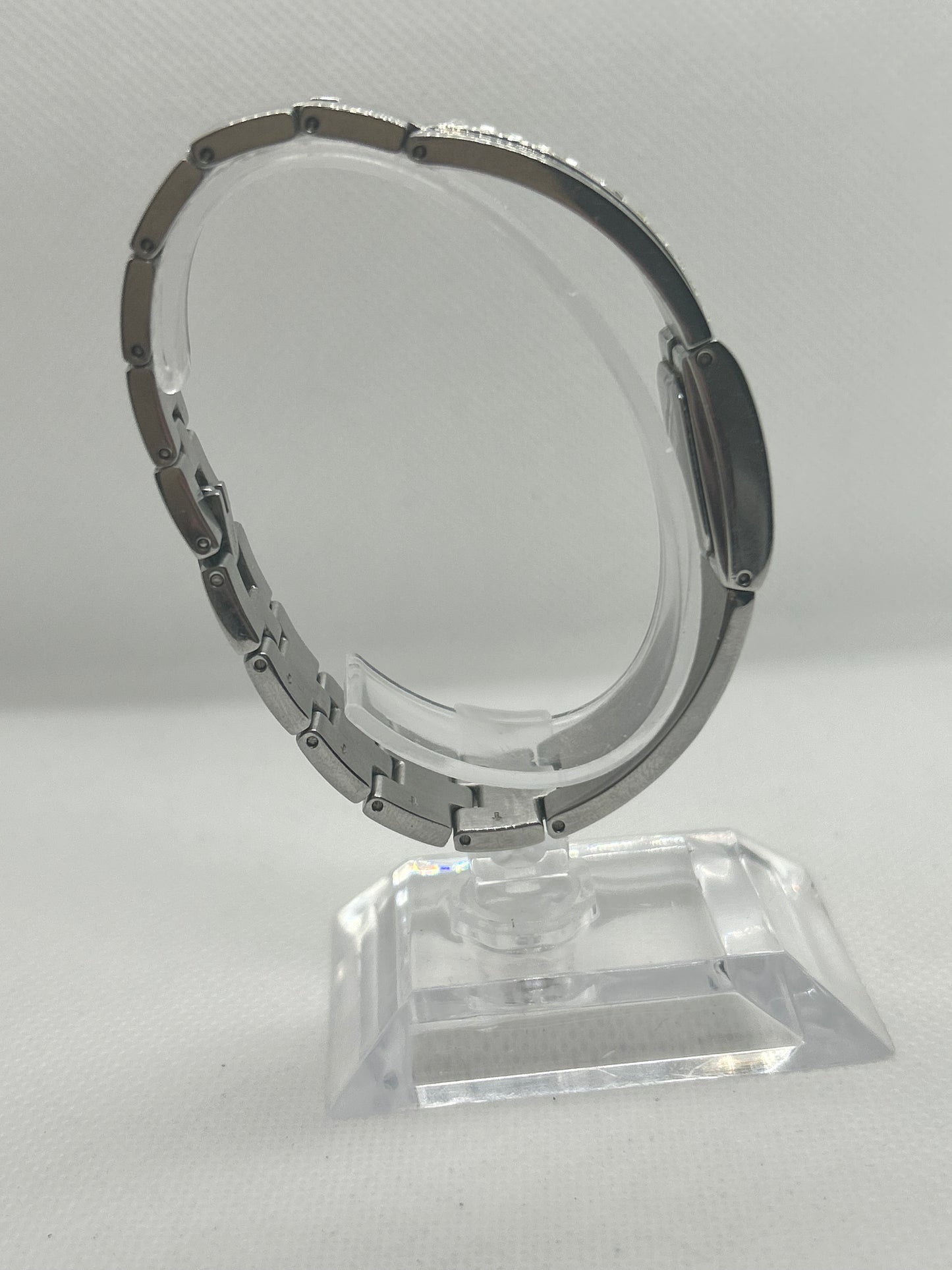 DKNY silver quartz bangle watch with “diamond” style bangle