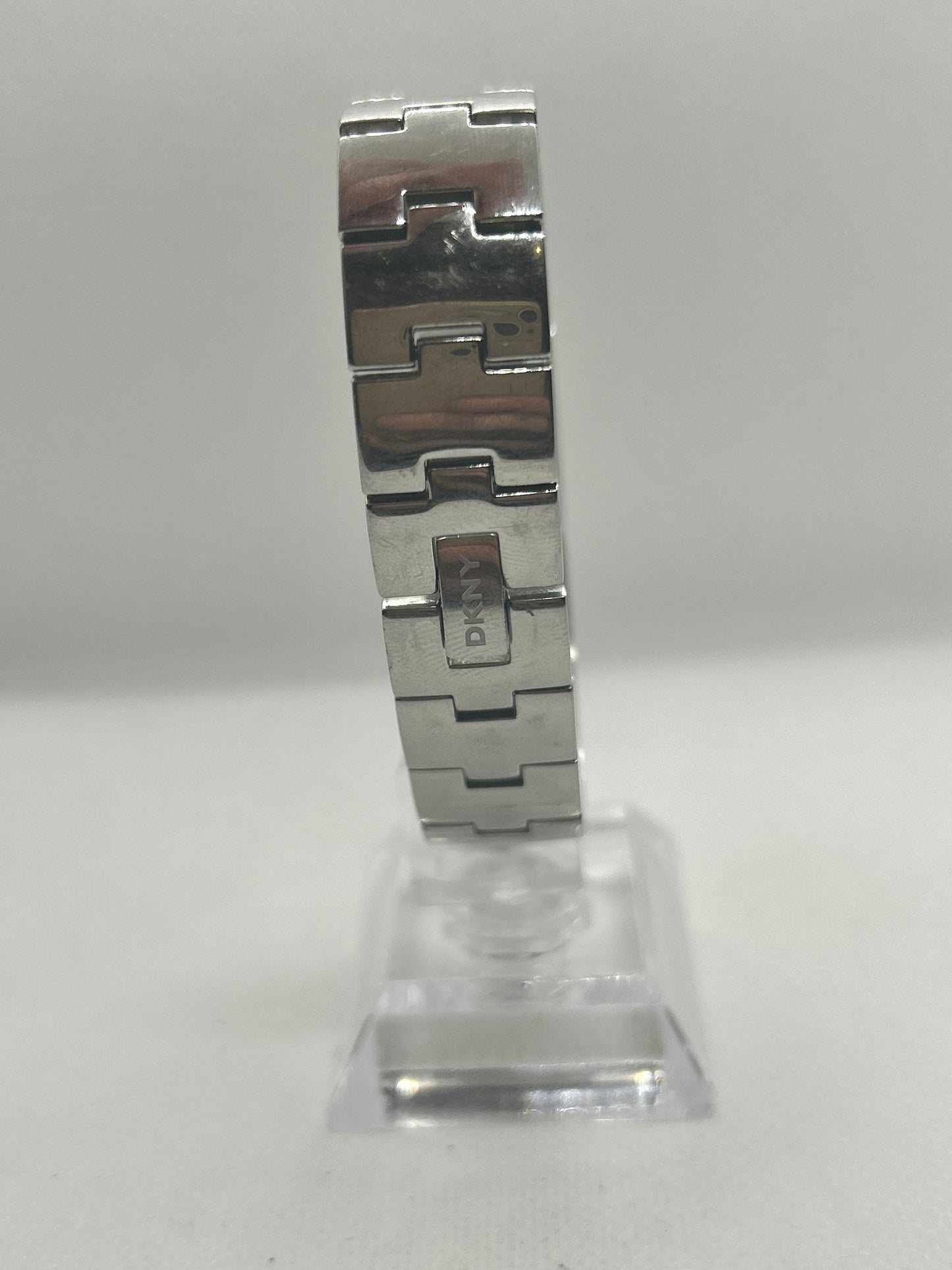 DKNY silver quartz bangle watch with “diamond” style bangle