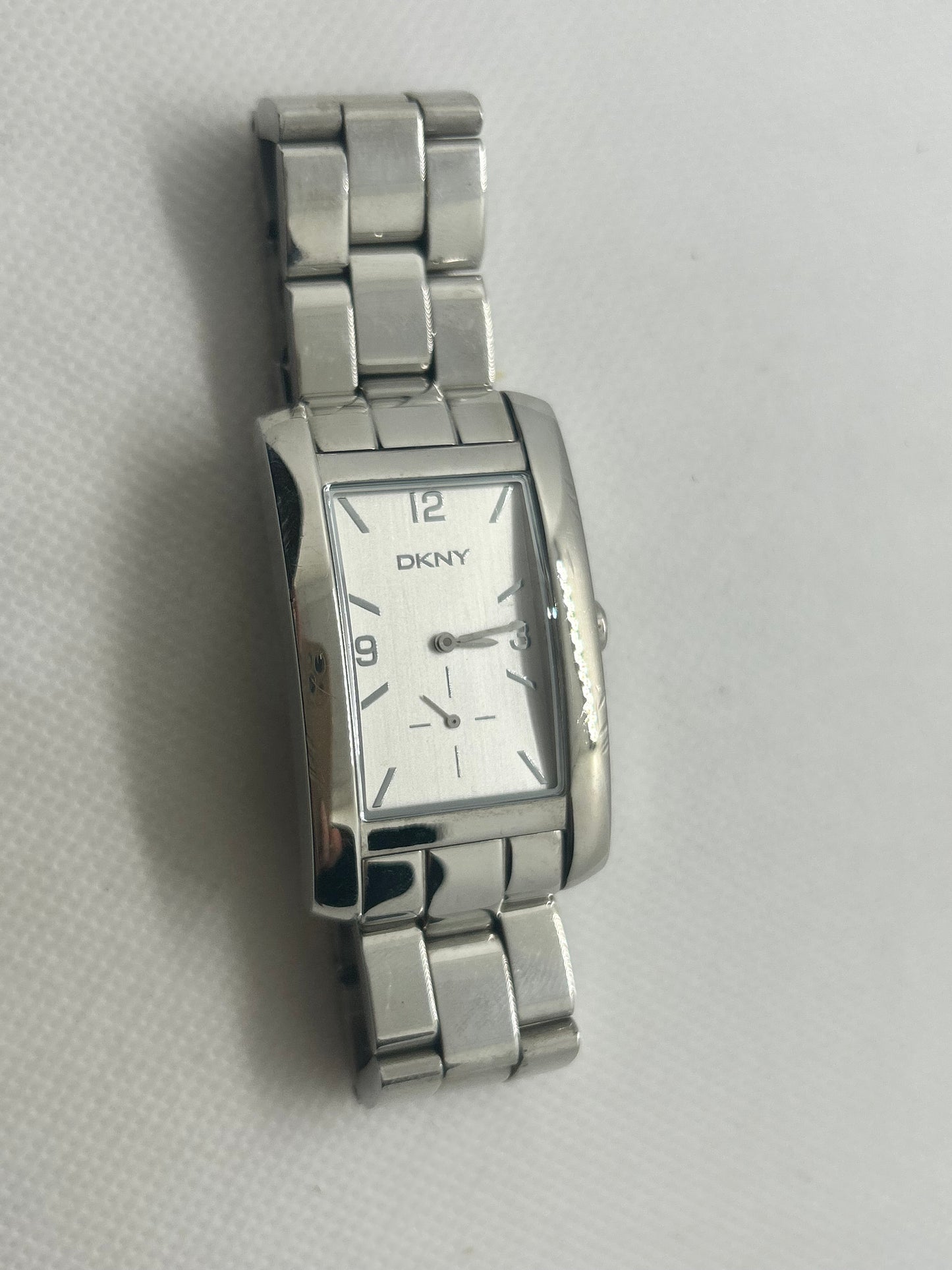 DKNY Silver ladies quartz tank style watch with sub seconds hand dial