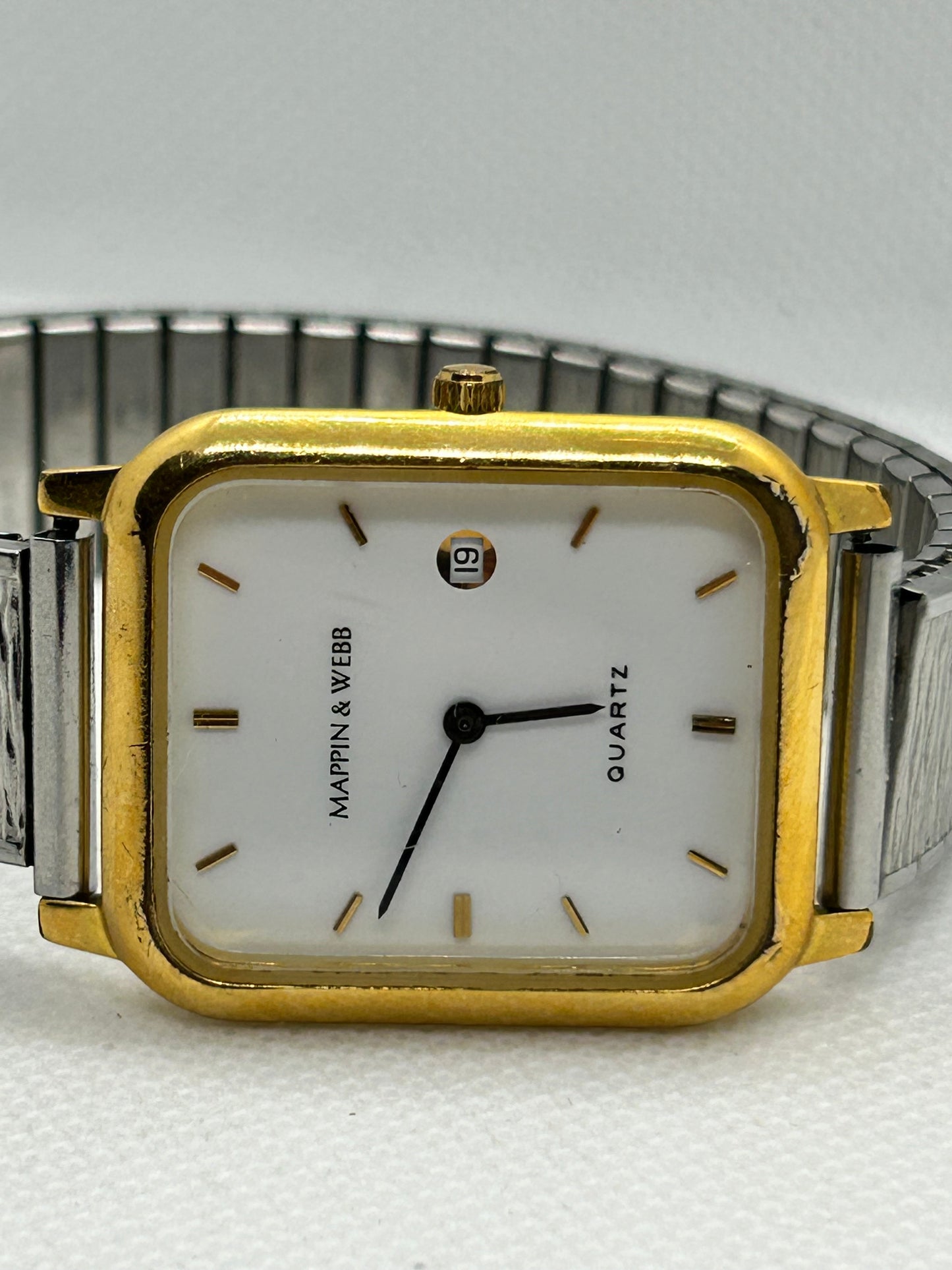 Mappin & Webb quartz watch silver and gold with white dial on stretch bracelet