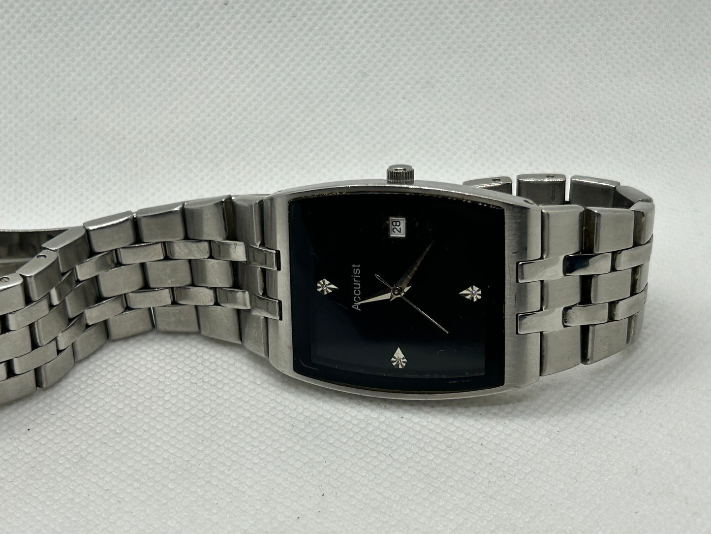 Accurist silver quartz watch with black dial, with box